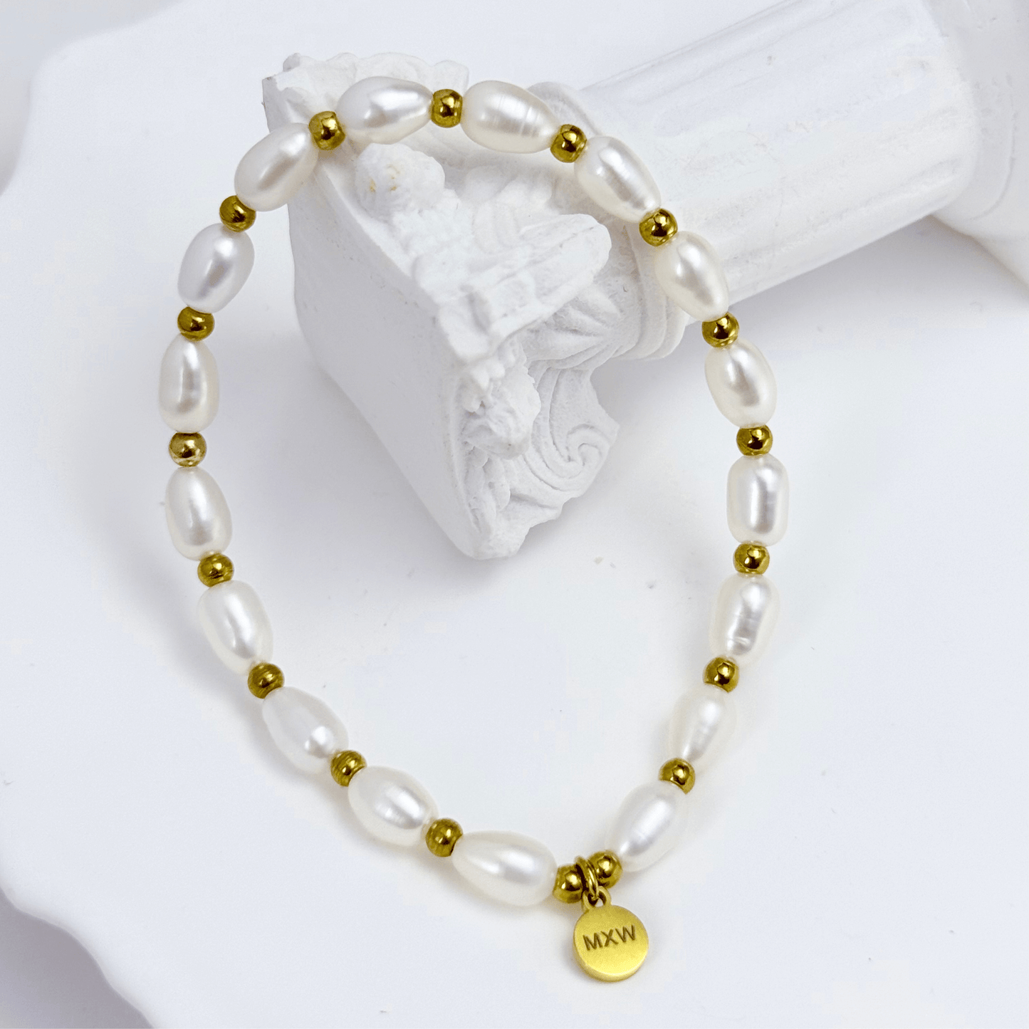 Pearl and Gold Bracelet with freshwater pearls and gold beads on stretch cord by MXW Jewellery