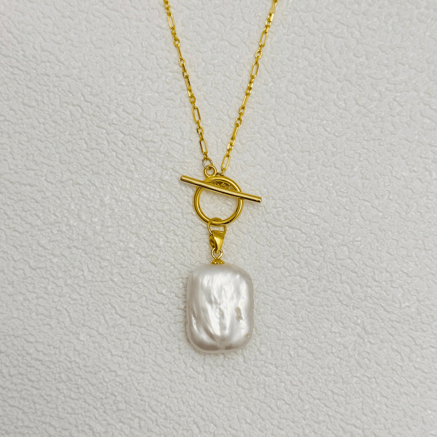 Elegant baroque freshwater pearl necklace with a toggle clasp, available in sterling silver and gold, featuring a delicate Mother & Daughter Link Chain
