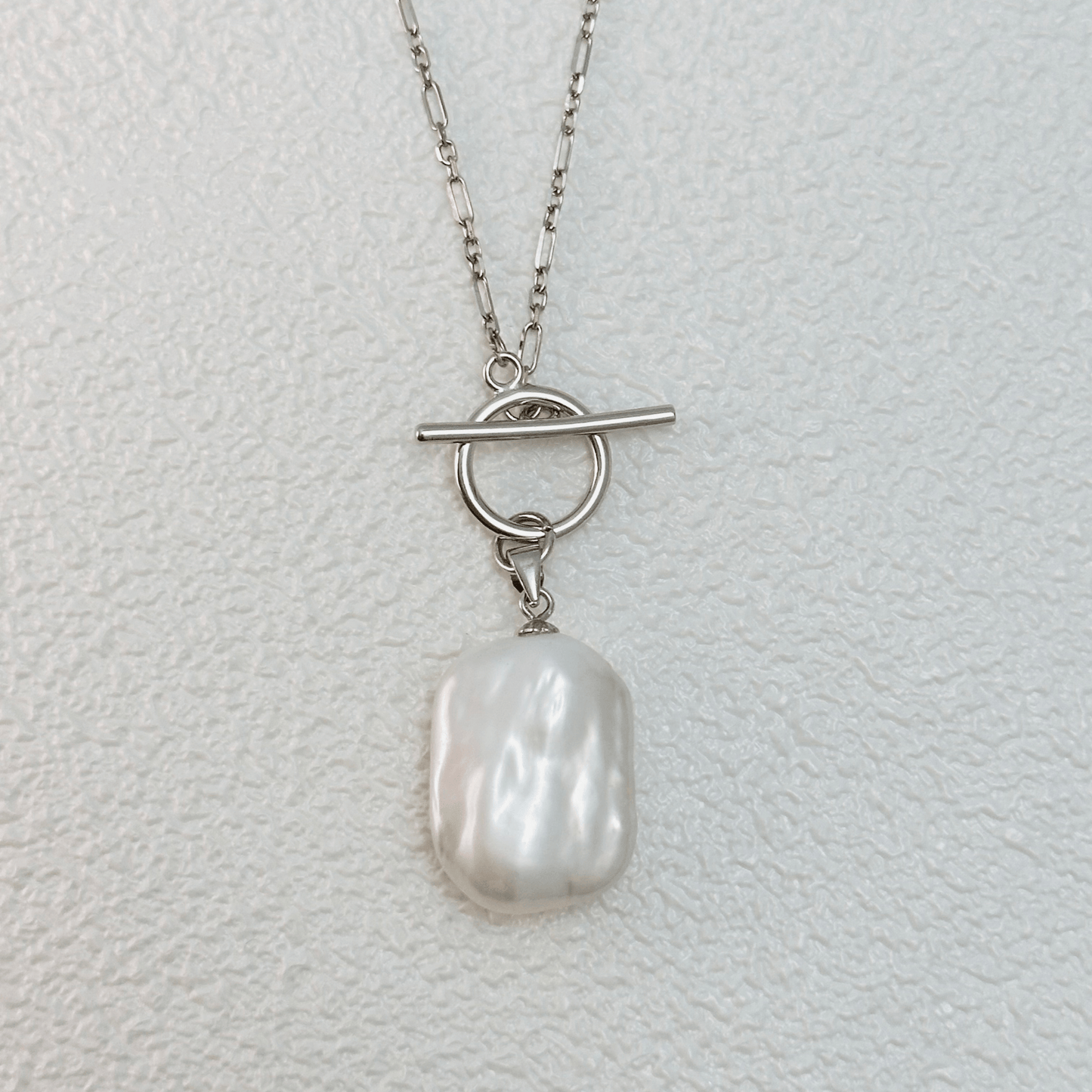 Elegant baroque freshwater pearl necklace with a toggle clasp, available in sterling silver and gold, featuring a delicate Mother & Daughter Link Chain