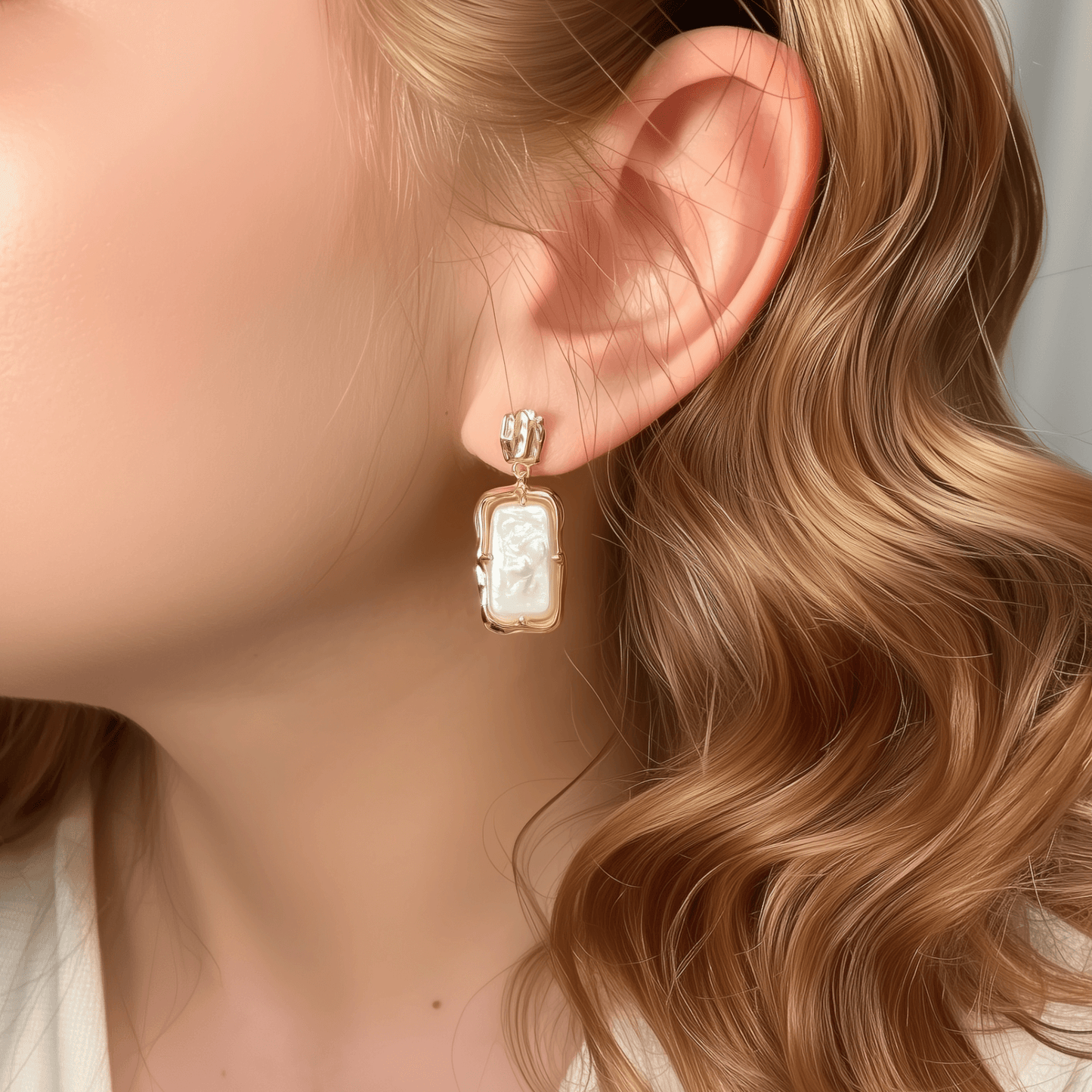 baroque pearl drop earrings with gold molten-style frame and natural silver-toned pearls