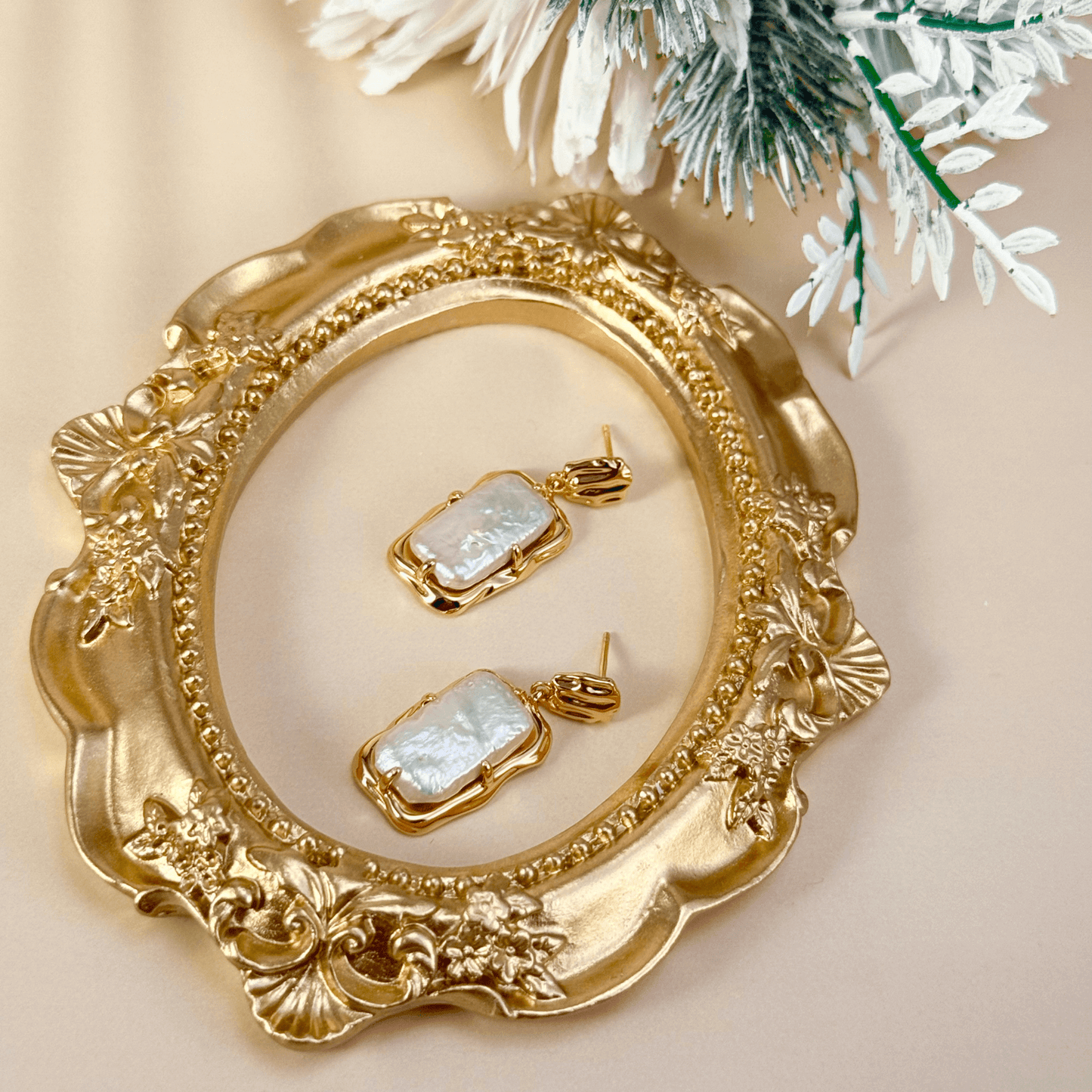 baroque pearl drop earrings with gold molten-style frame and natural silver-toned pearls