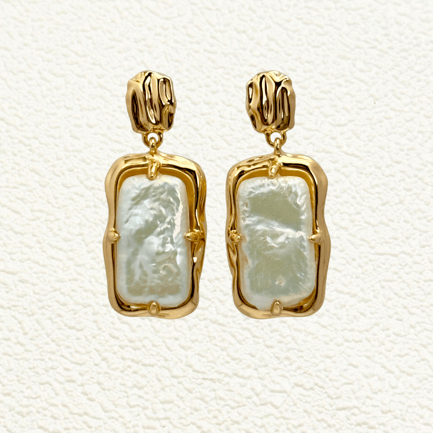 baroque pearl drop earrings with gold molten-style frame and natural silver-toned pearls