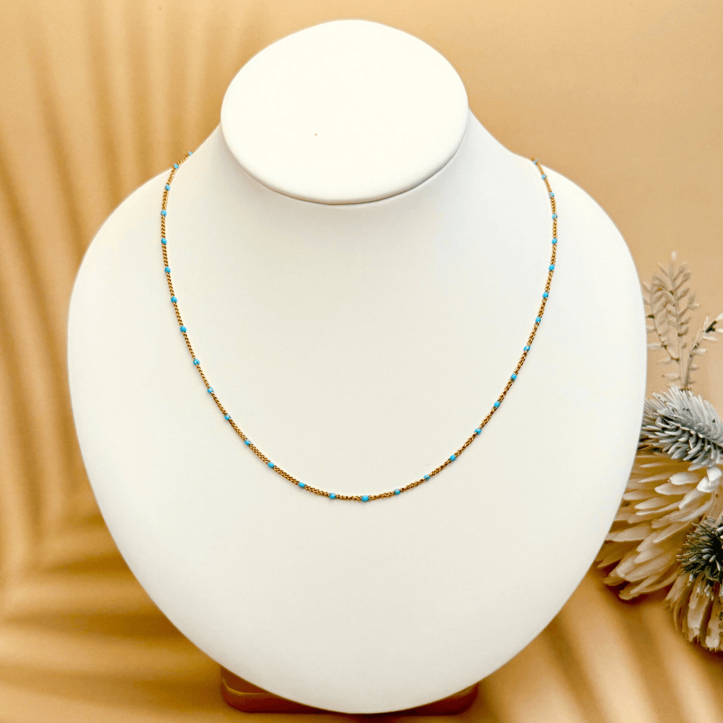 PVD gold stainless steel chain with blue enamel dot accents, versatile as necklace, bracelet, or anklet