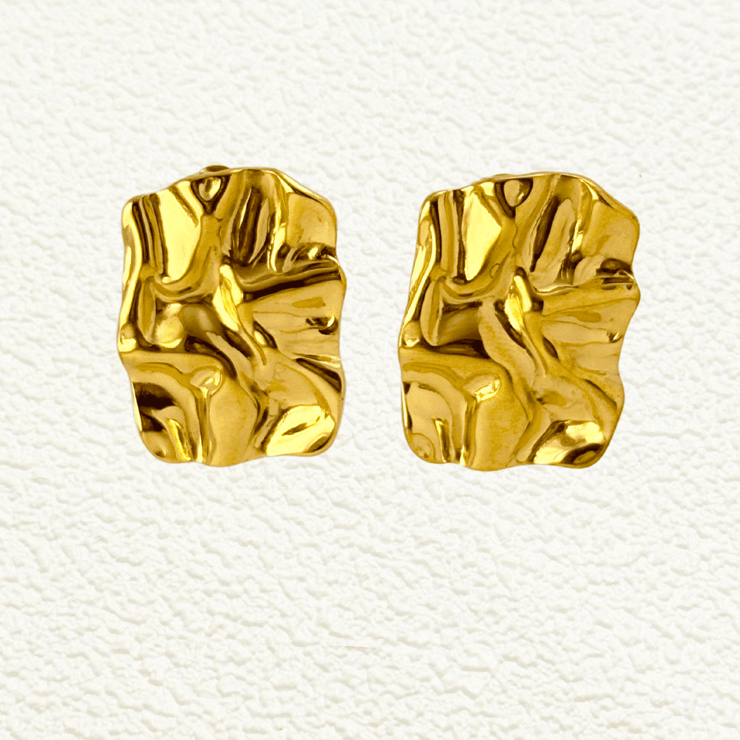 Gold and silver crinkled texture stud earrings – modern statement stainless steel earrings, PVD plated, waterproof and hypoallergenic.
