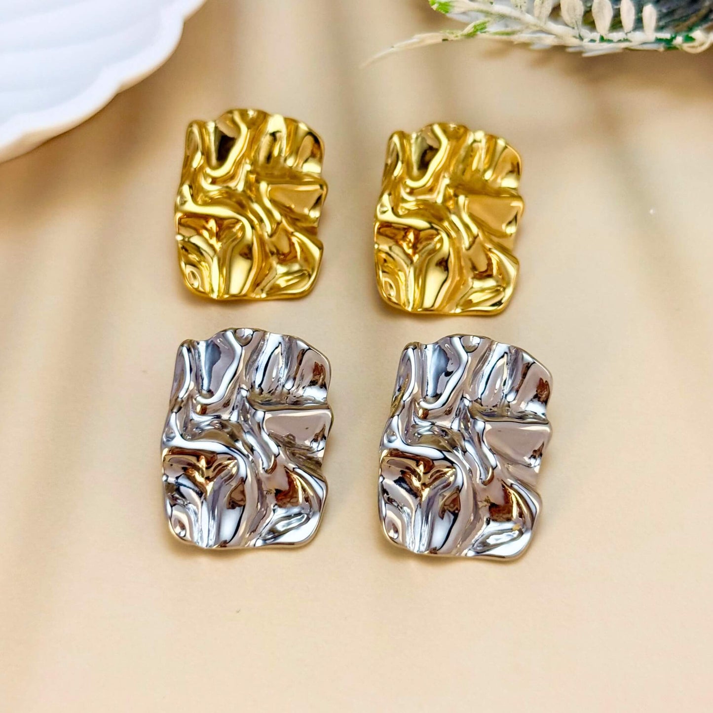 Gold and silver crinkled texture stud earrings – modern statement stainless steel earrings, PVD plated, waterproof and hypoallergenic.
