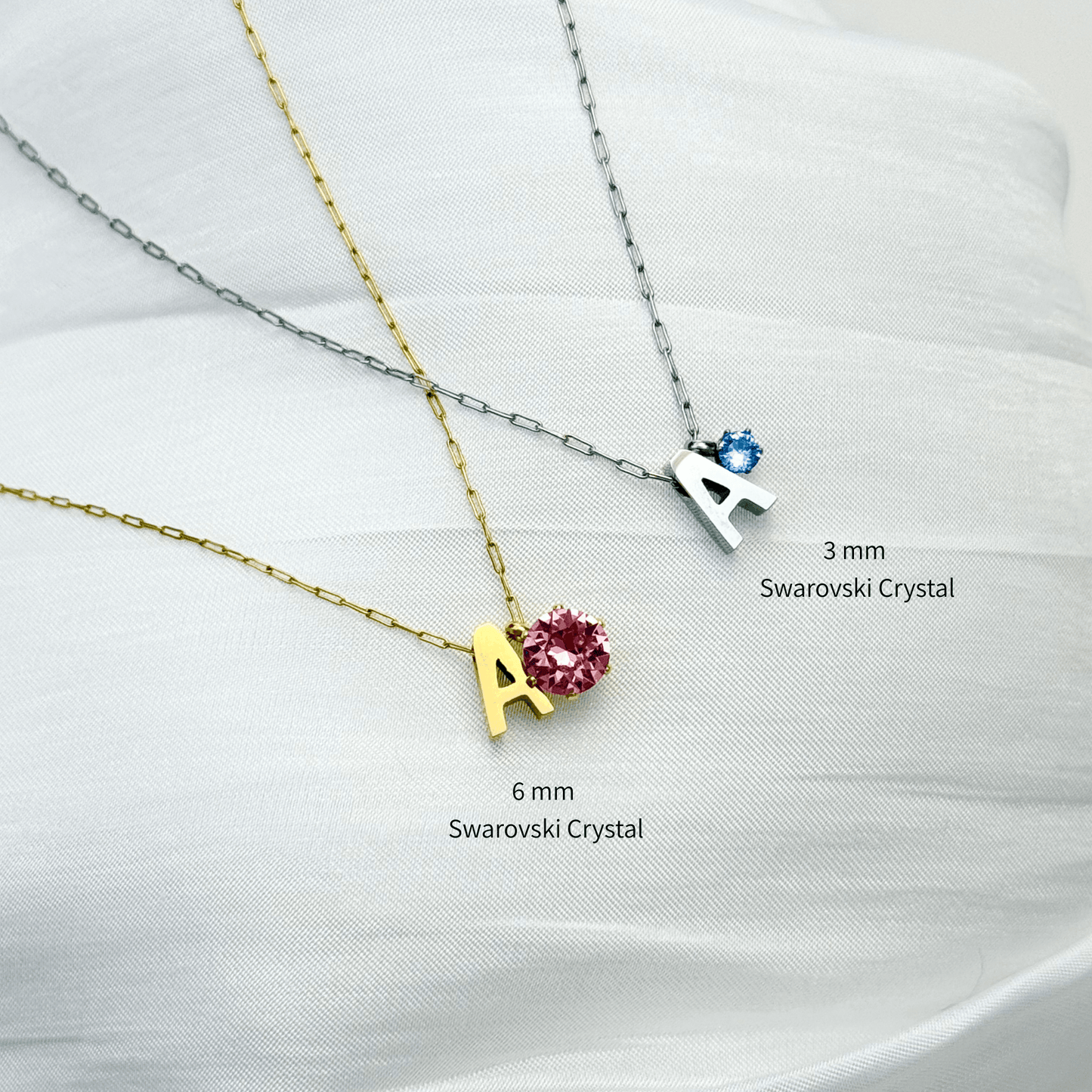 Personalised initial necklace featuring a Swarovski crystal charm on a delicate 1 mm chain, in gold and silver, hypoallergenic and tarnish-resistant.