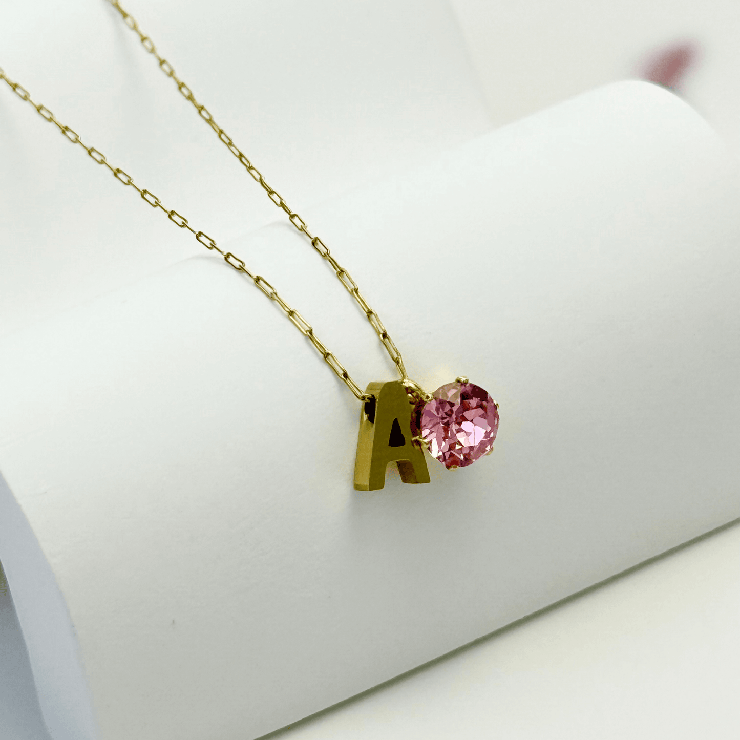 Personalised initial necklace featuring a Swarovski crystal charm on a delicate 1 mm chain, in gold and silver, hypoallergenic and tarnish-resistant.