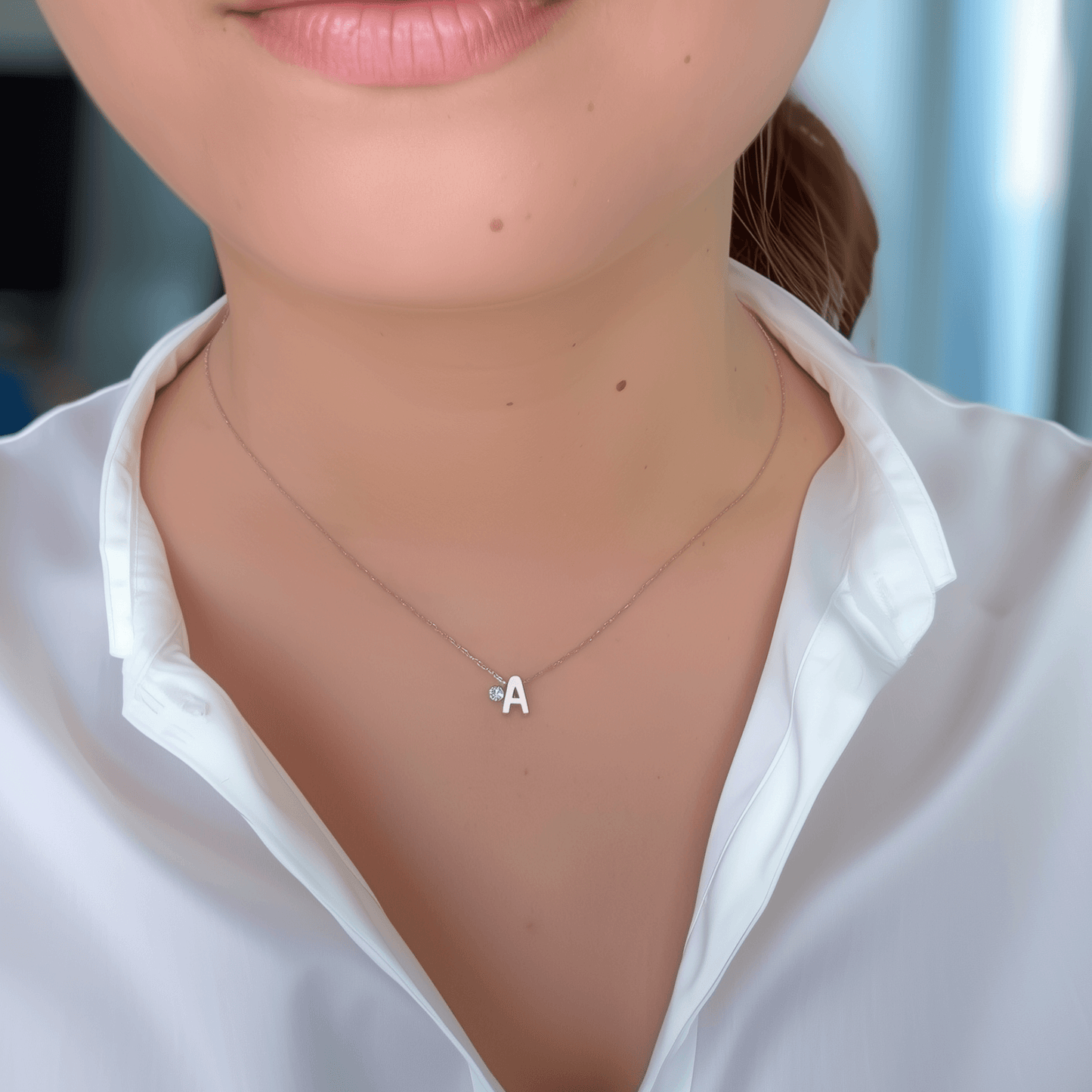 Personalized initial necklace featuring a Swarovski crystal charm on a delicate 1 mm chain, in gold and silver, hypoallergenic and tarnish-resistant.