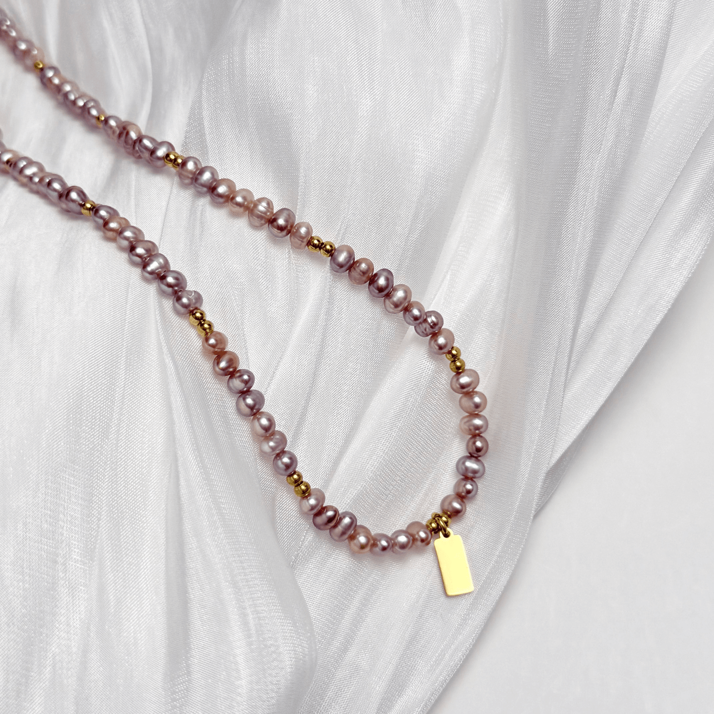 Custom purple pearl necklace with engravable charm in gold or silver – waterproof personalised jewellery.