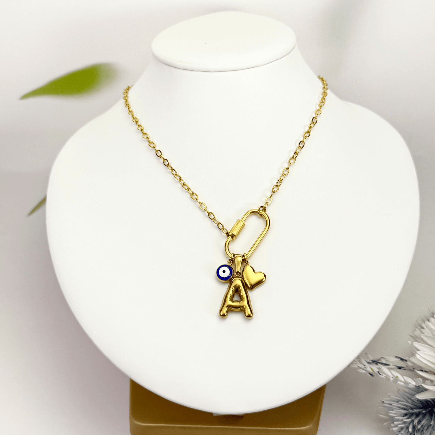 Custom rectangular ring necklace with detachable charms – initial, evil eye, and heart for love and protection.