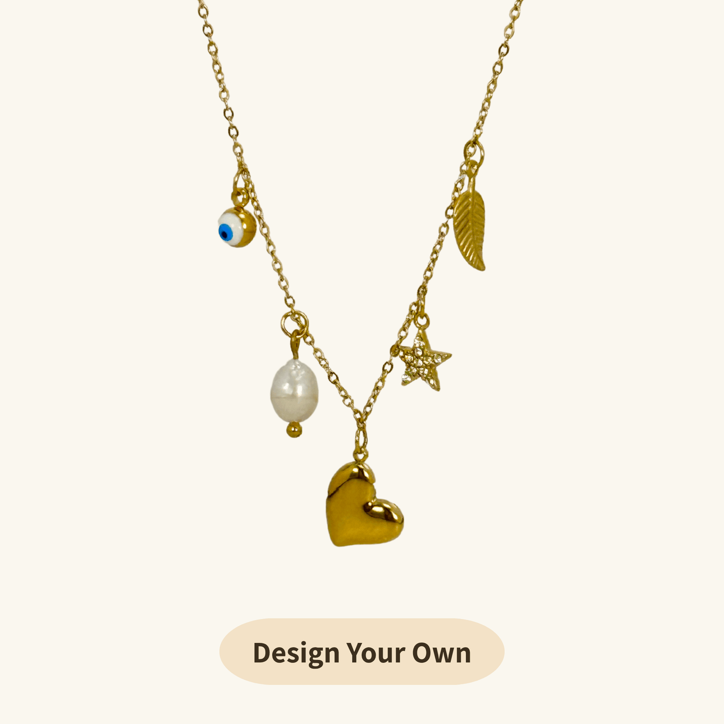 Mini gold charm necklace with evil eye, heart, pearl, star, and leaf on waterproof chain