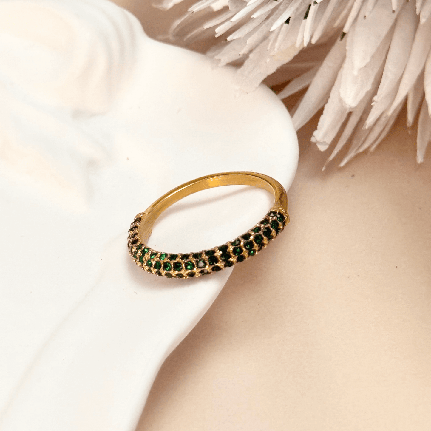 Elegant gold stacking ring with emerald-coloured zircon stones, waterproof and tarnish-resistant, perfect for stacking or wearing solo for a sophisticated touch.