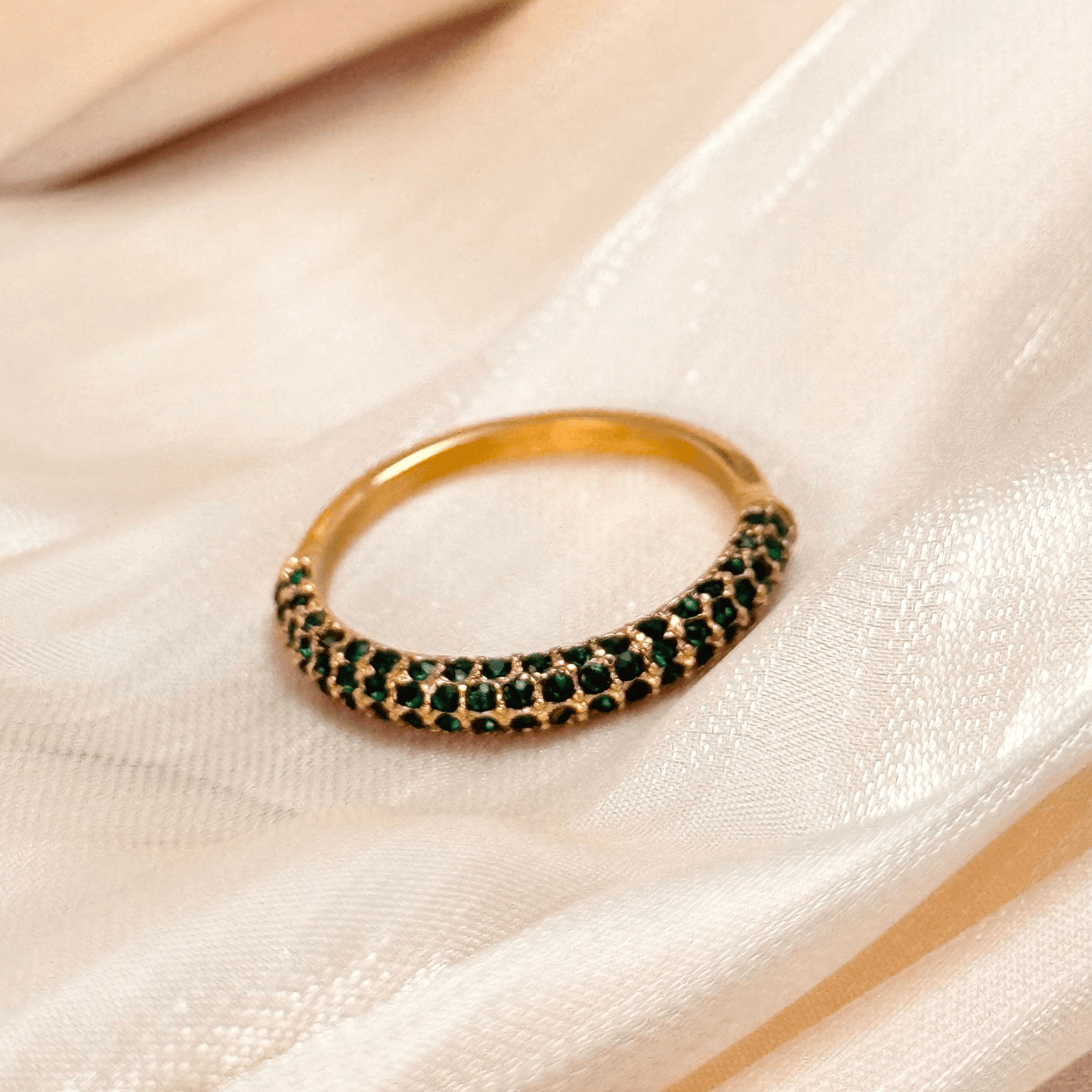 Elegant gold stacking ring with emerald-coloured zircon stones, waterproof and tarnish-resistant, perfect for stacking or wearing solo for a sophisticated touch.