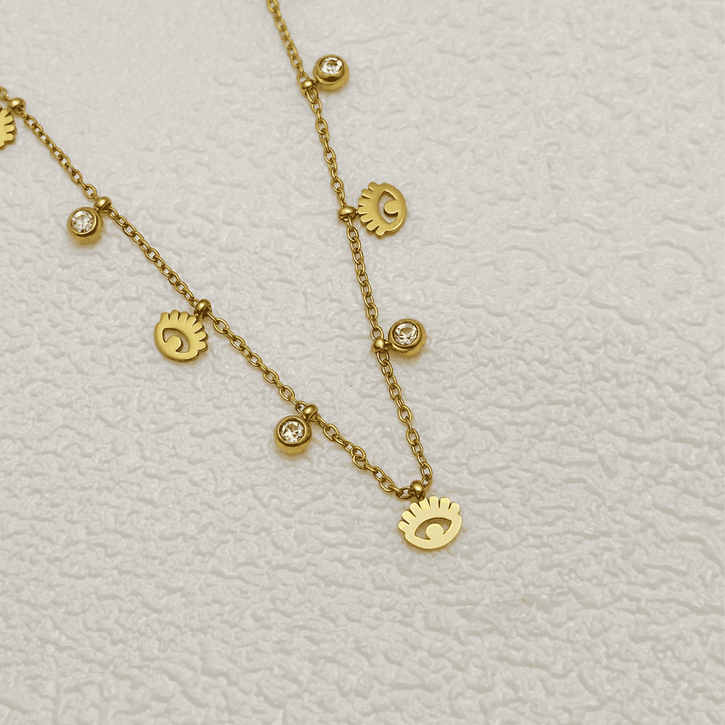 Dainty gold-plated evil eye necklace with zircon accents, waterproof and hypoallergenic.