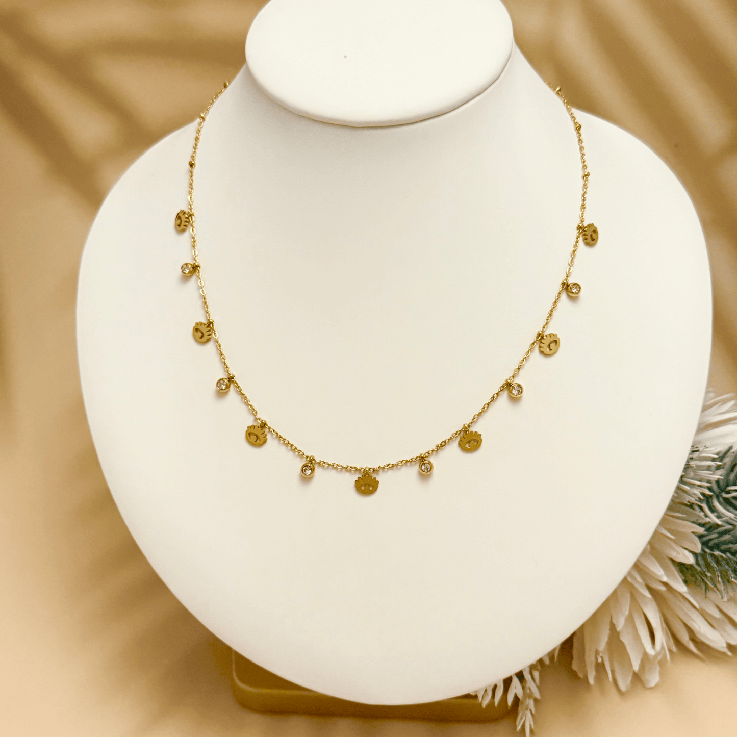 Dainty gold-plated evil eye necklace with zircon accents, waterproof and hypoallergenic.