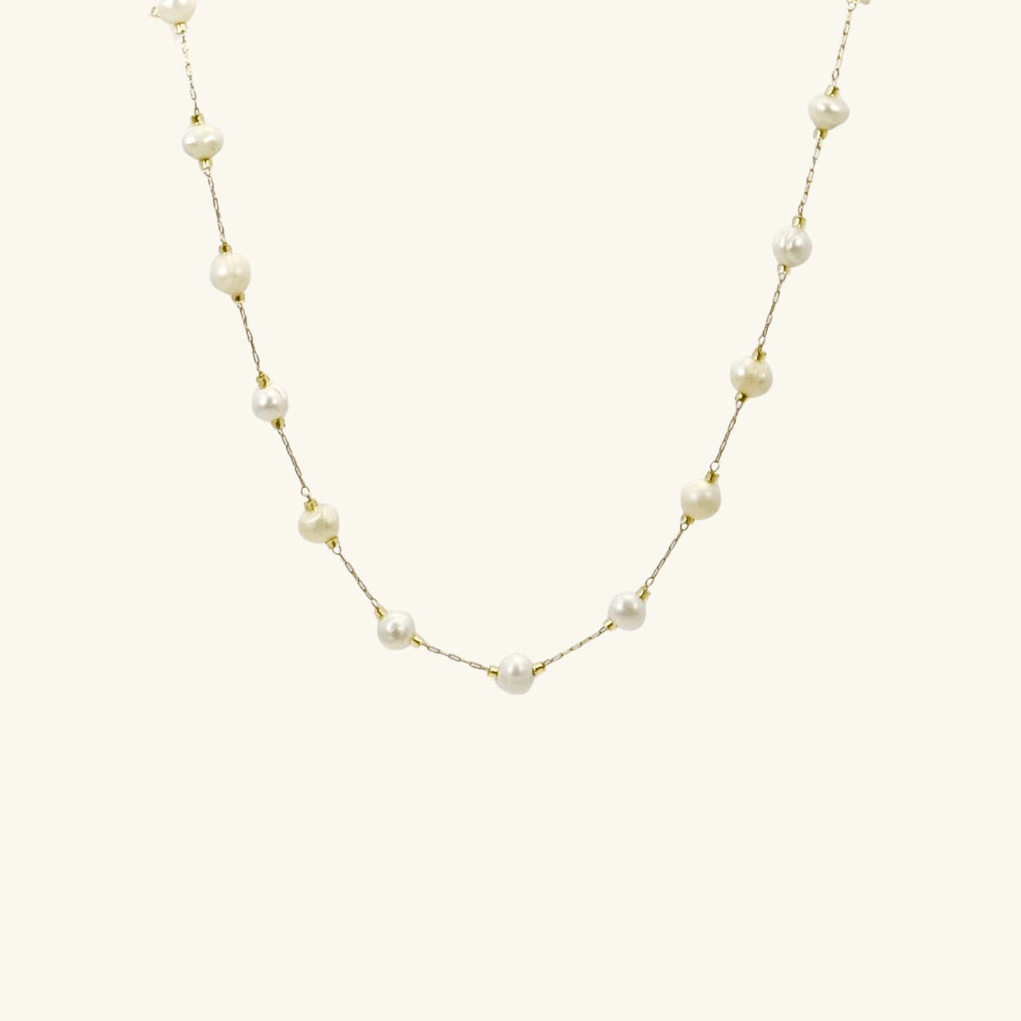 Elegant freshwater pearl necklace on a dainty gold chain, a timeless jewellery piece perfect for bridesmaids, weddings, or meaningful everyday wear.