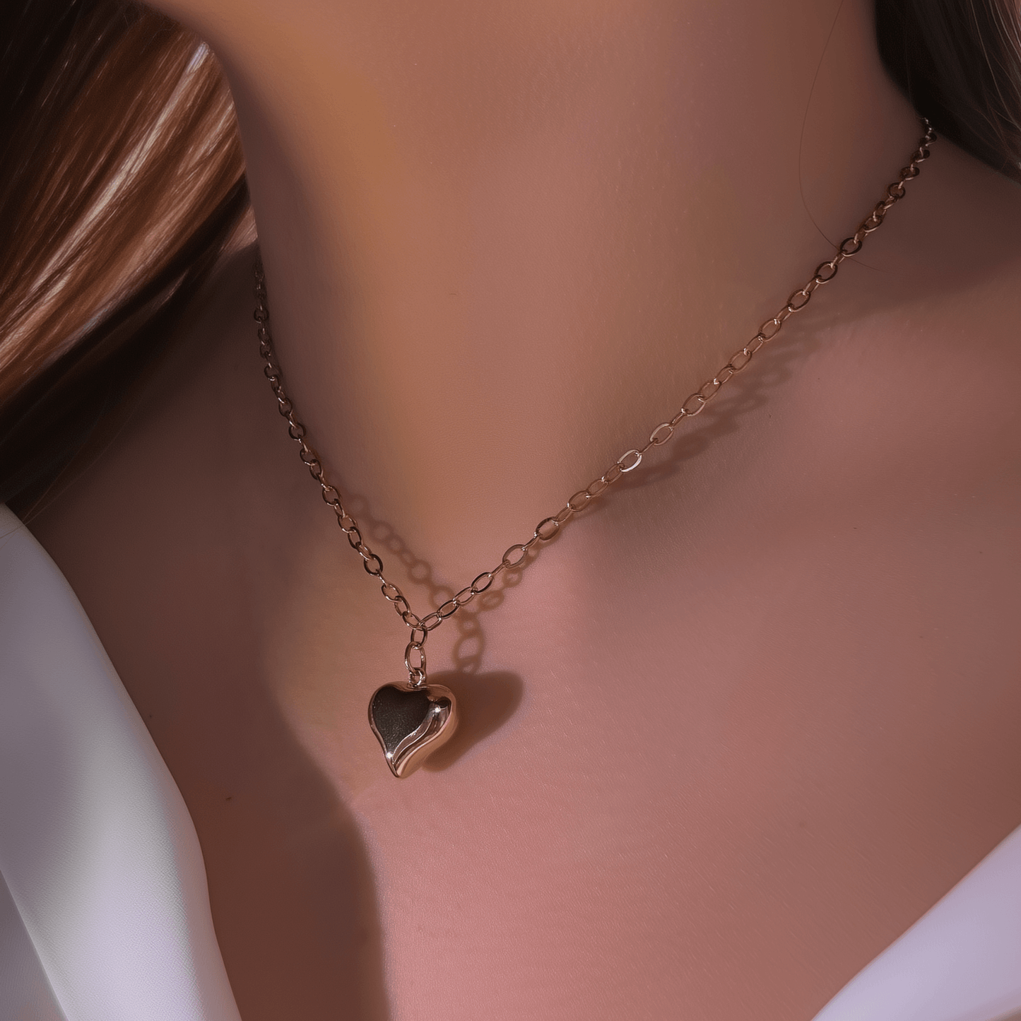 Gold chunky heart pendant necklace on model, waterproof and bold statement design