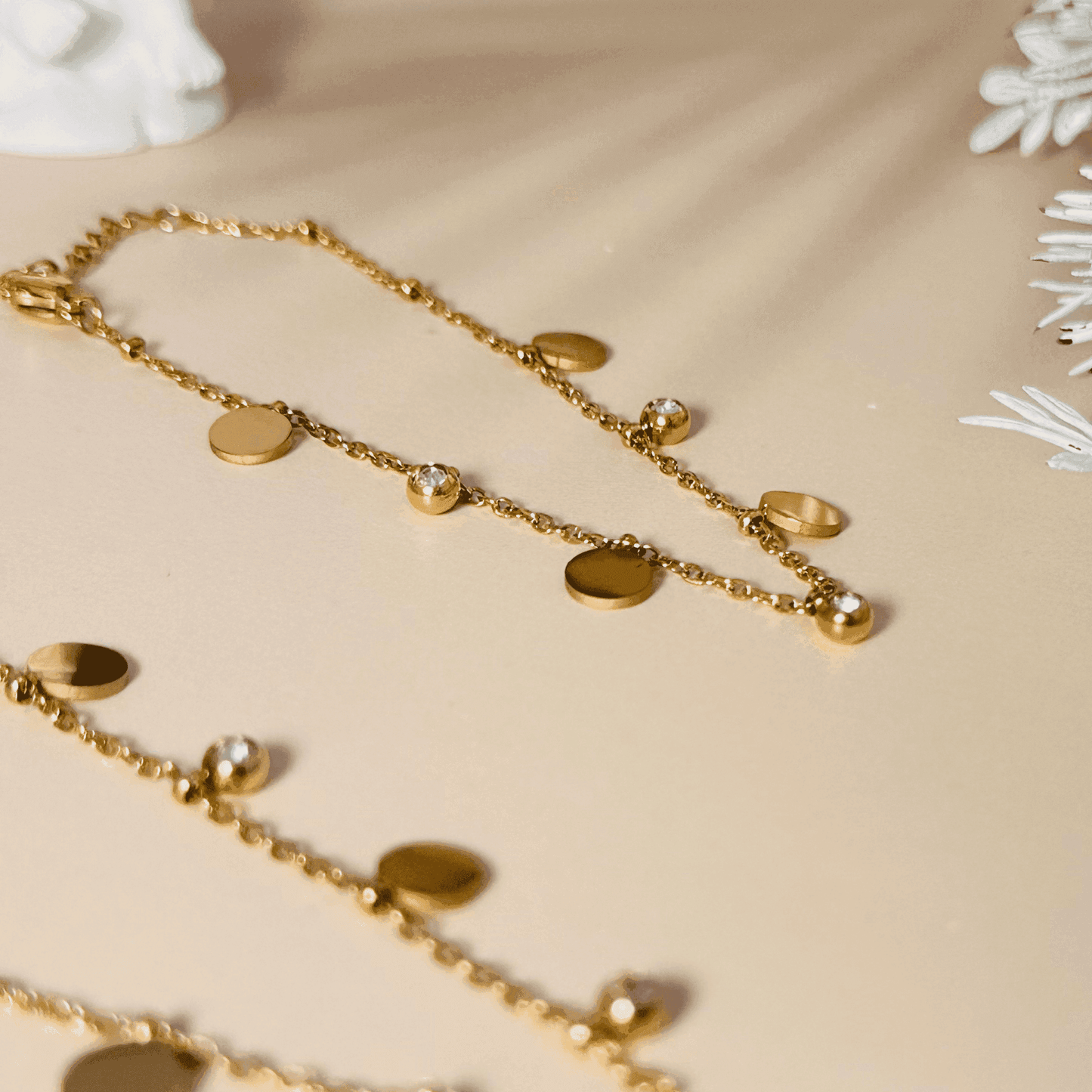Elegant Luna necklace featuring gold disc charms and zircon gemstones, crafted with waterproof gold-plated stainless steel.