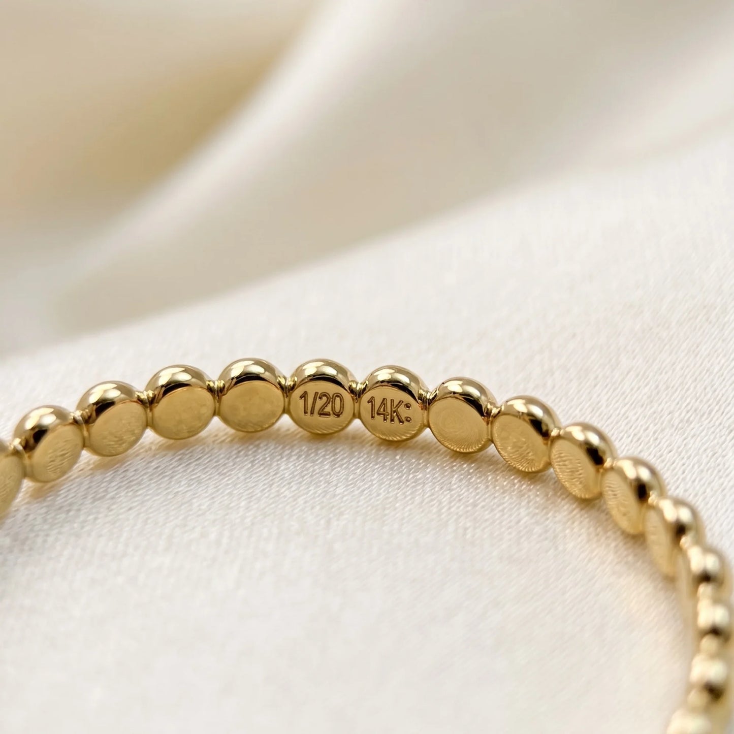 Dainty 14K gold filled stacking ring with small light-catching disc details