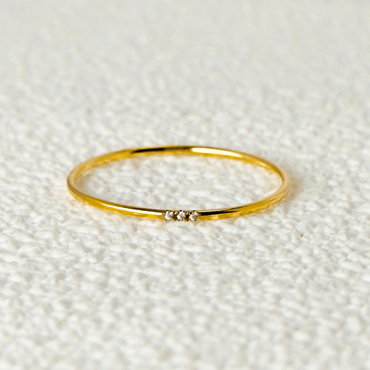 gold filled Tiny Diamond Stackable Ring with three sparkling diamonds, minimalist and versatile design.