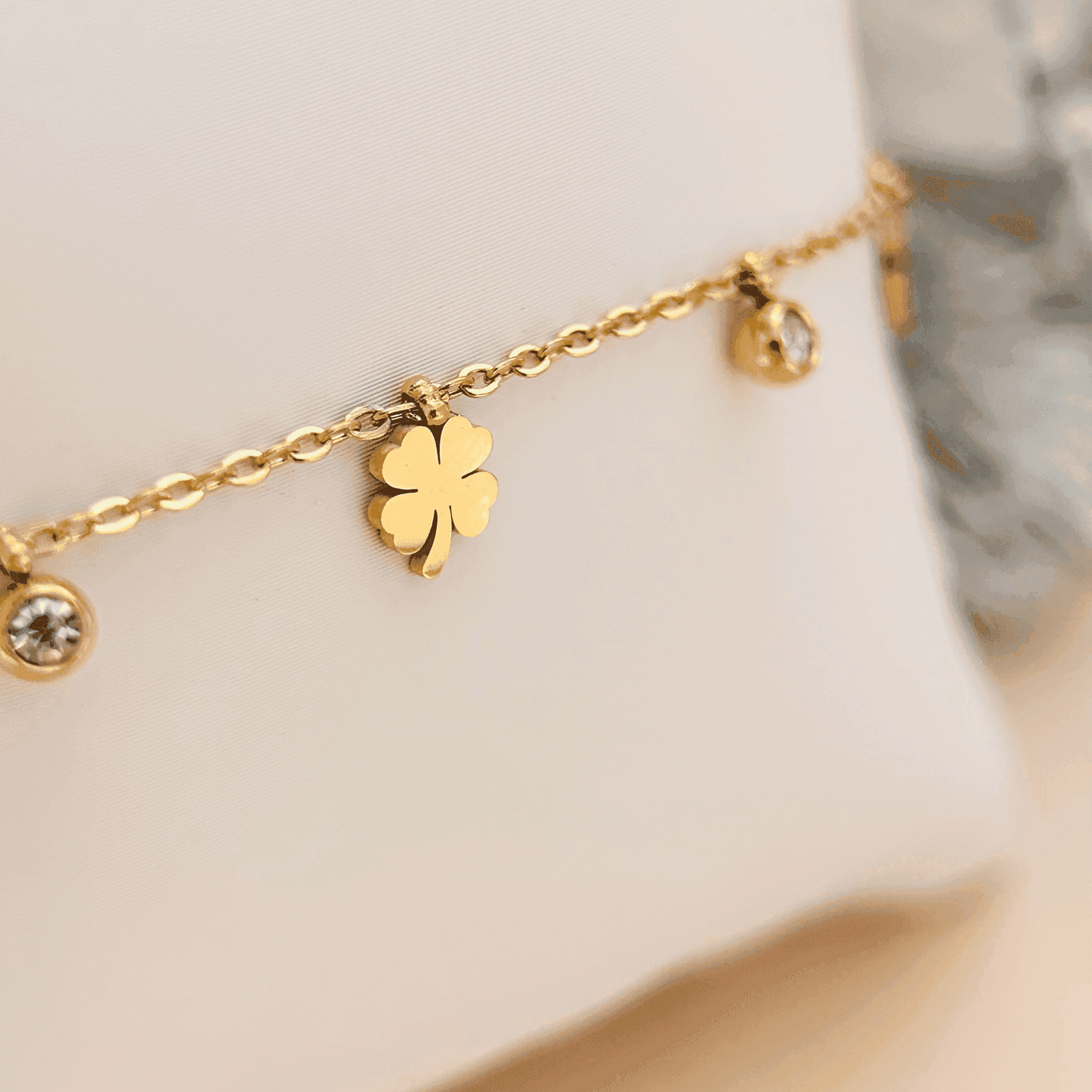 Gold four-leaf clover charm necklace or bracelet with zircon accents, waterproof and tarnish-resistant