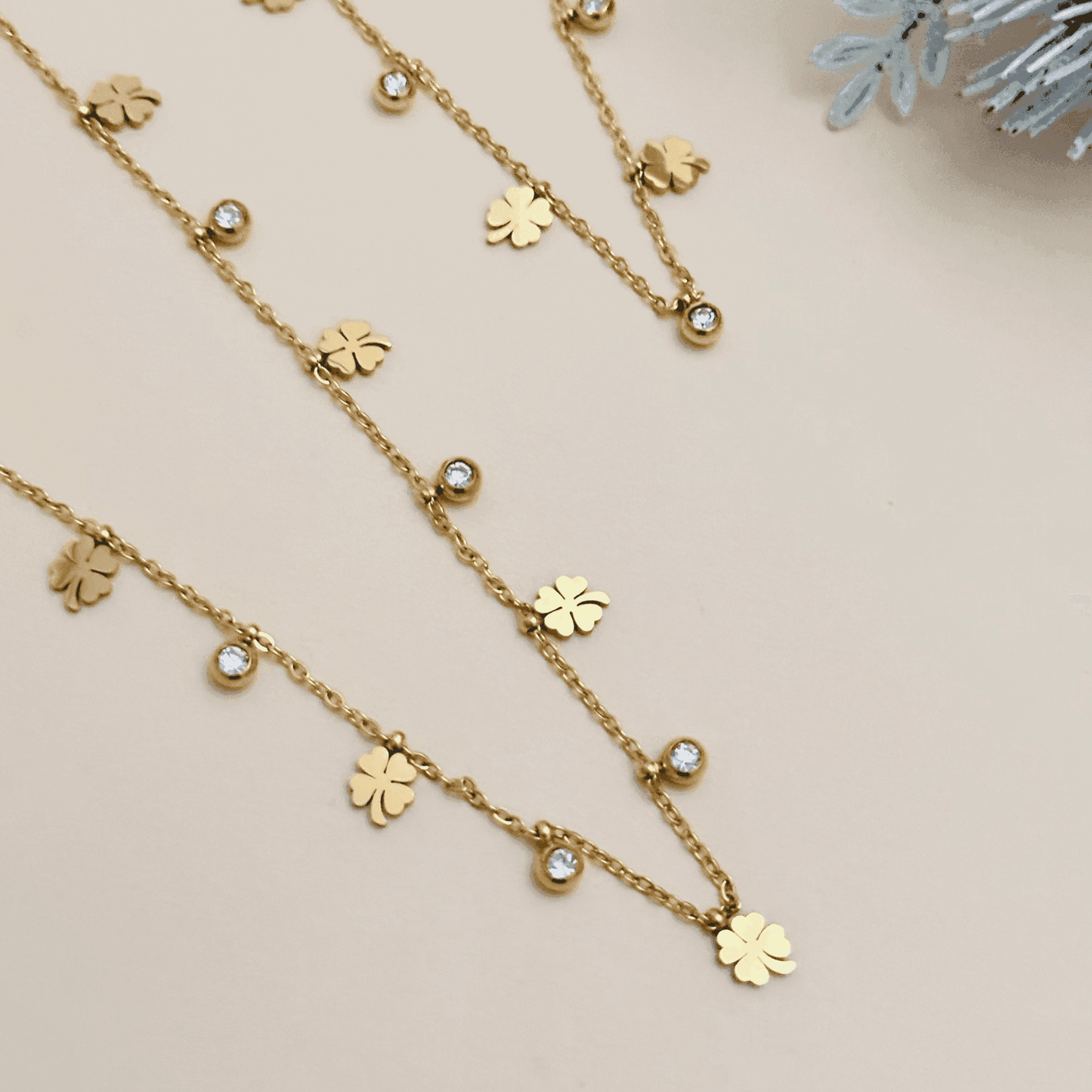 Gold four-leaf clover charm necklace or bracelet with zircon accents, waterproof and tarnish-resistant