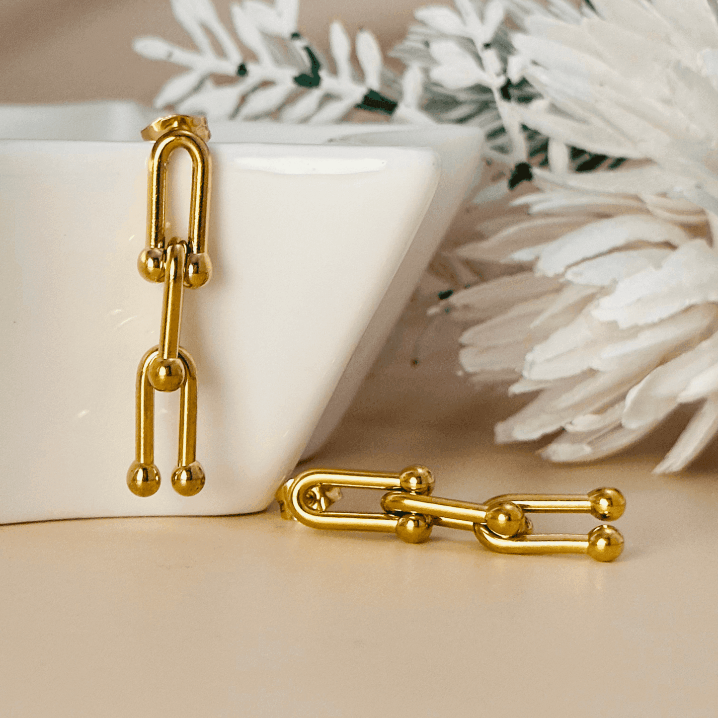 Nova Gold Geometric Drop Earrings - 18K gold-plated stainless steel with a bold, modern design.