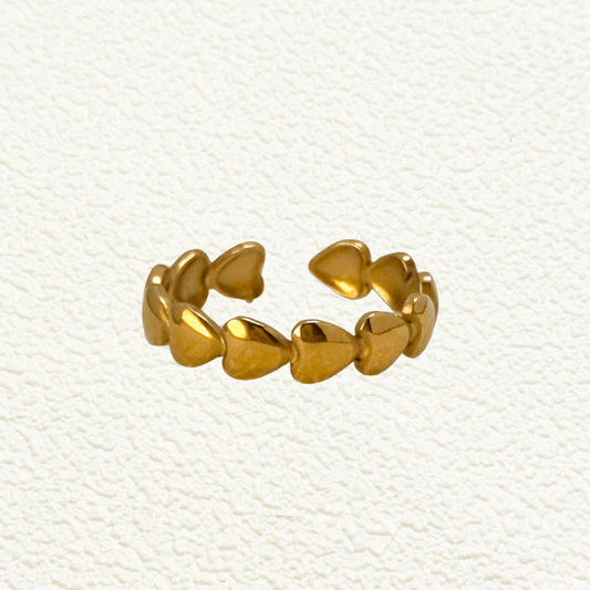Gold Heart Stacking Ring - waterproof, adjustable, open-band ring with sculpted heart shapes. Perfect for stacking or wearing solo.