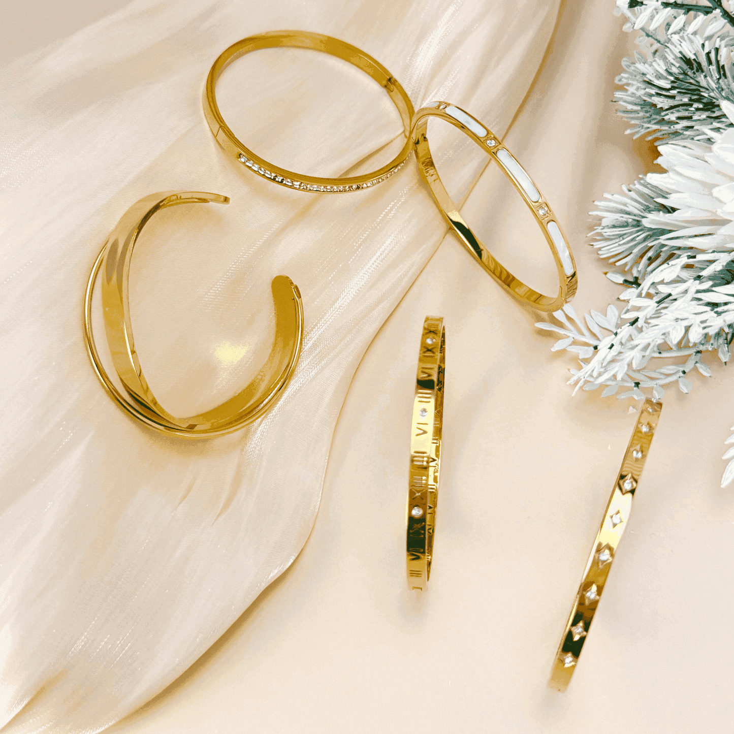 A collection of gold-plated bangles from MXW Jewellery, featuring zircon accents, Roman numerals, and smooth polished finishes, waterproof and tarnish-free.