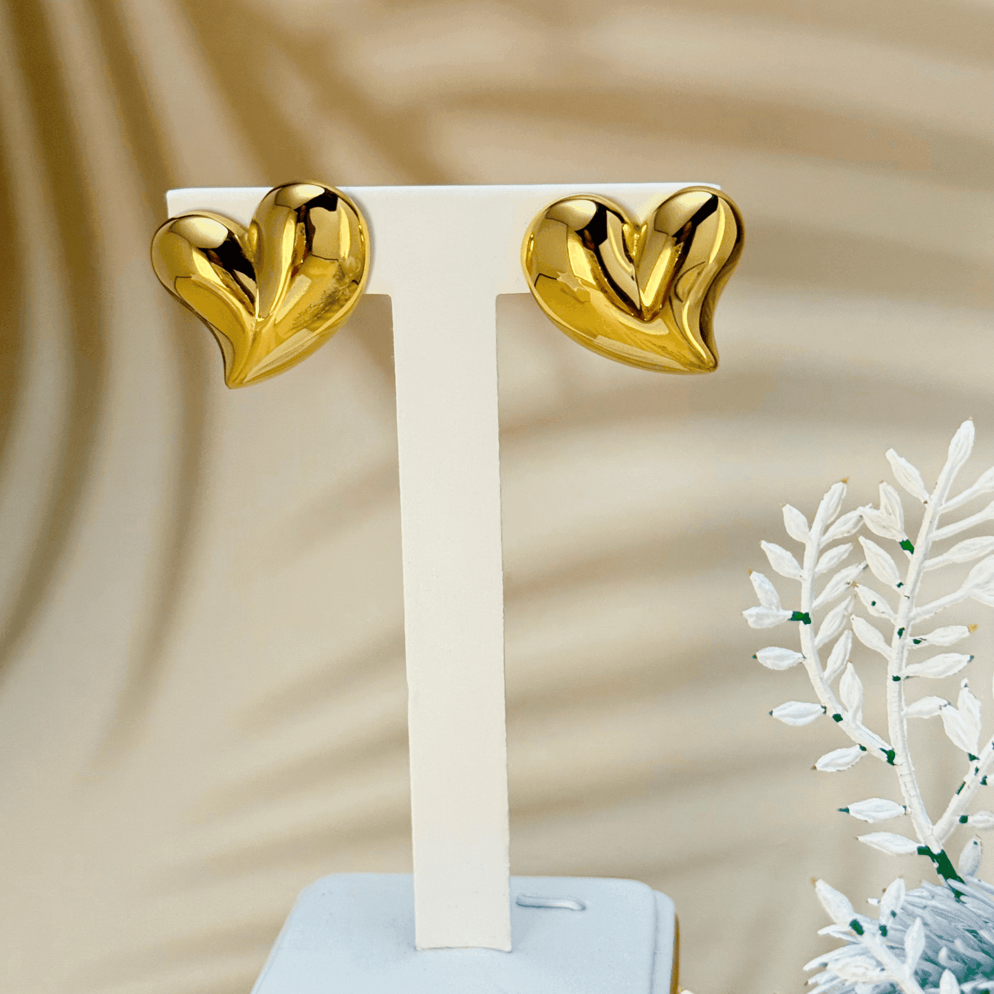 Discover the Valencia gold heart stud earrings, featuring a sculpted design with a high-polish finish. Waterproof, hypoallergenic & tarnish-resistant.