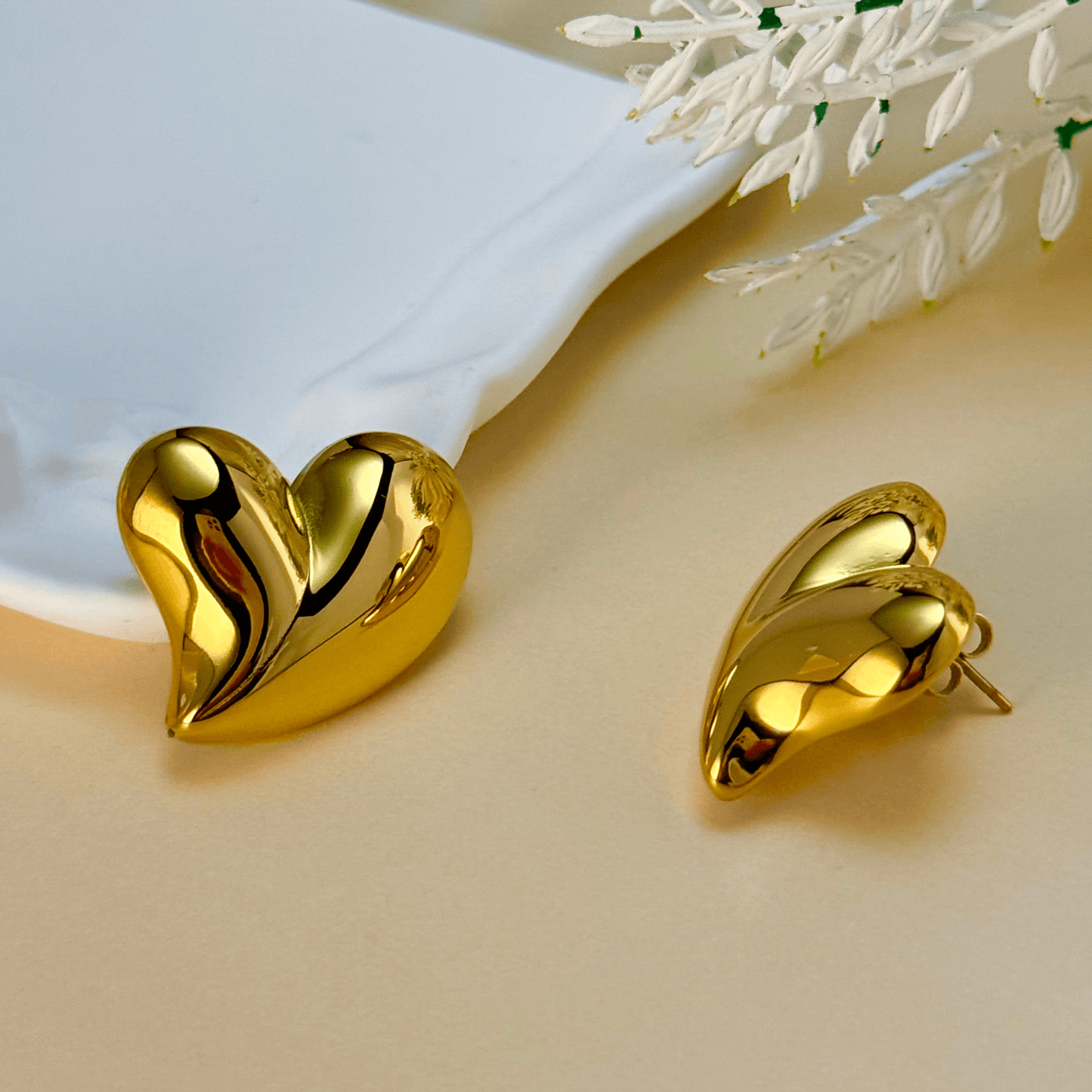 Discover the Valencia gold heart stud earrings, featuring a sculpted design with a high-polish finish. Waterproof, hypoallergenic & tarnish-resistant.