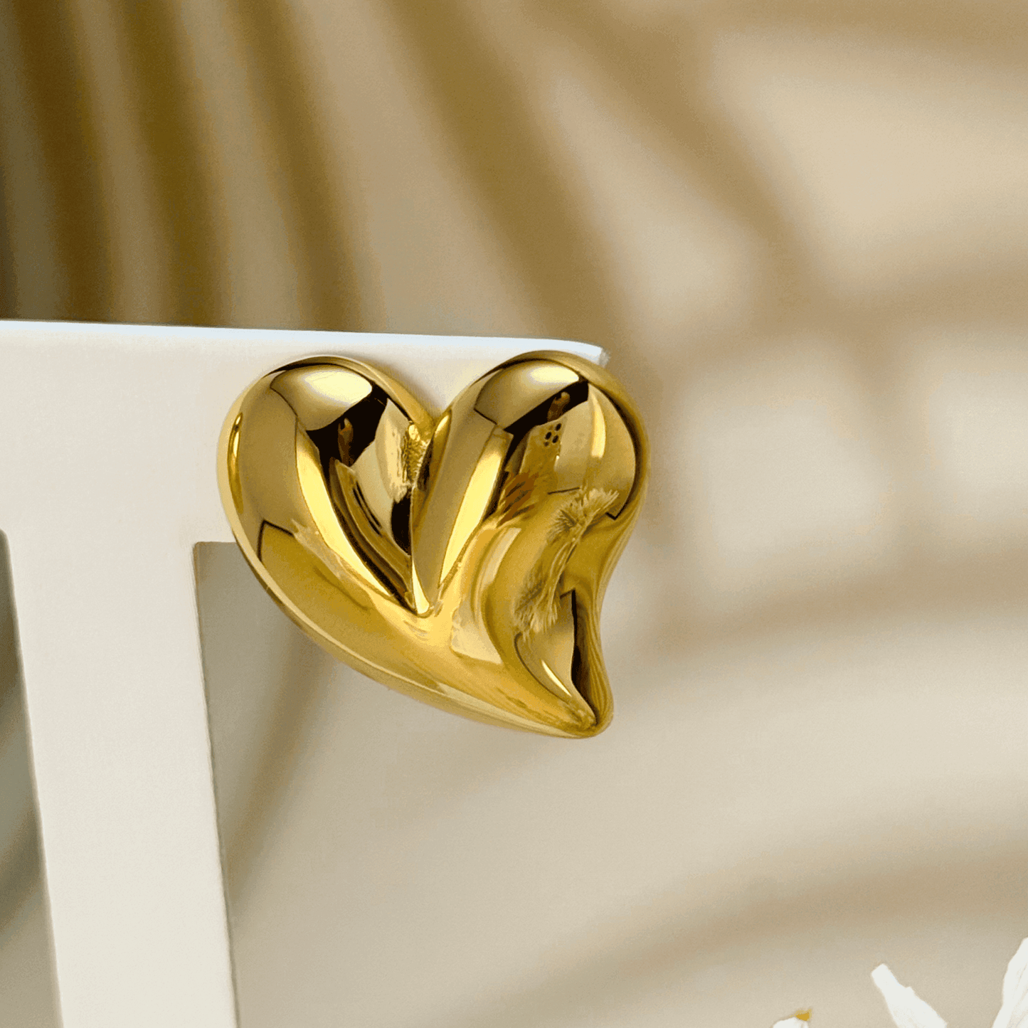 Discover the Valencia gold heart stud earrings, featuring a sculpted design with a high-polish finish. Waterproof, hypoallergenic & tarnish-resistant.