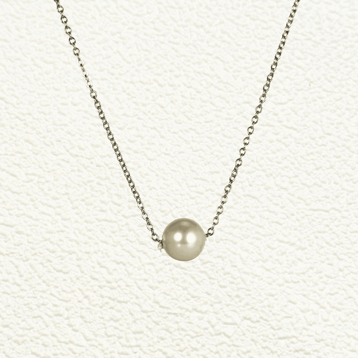 Minimalist Swarovski crystal pearl necklace with single pearl on gold and silver stainless steel chains, elegant everyday jewellery