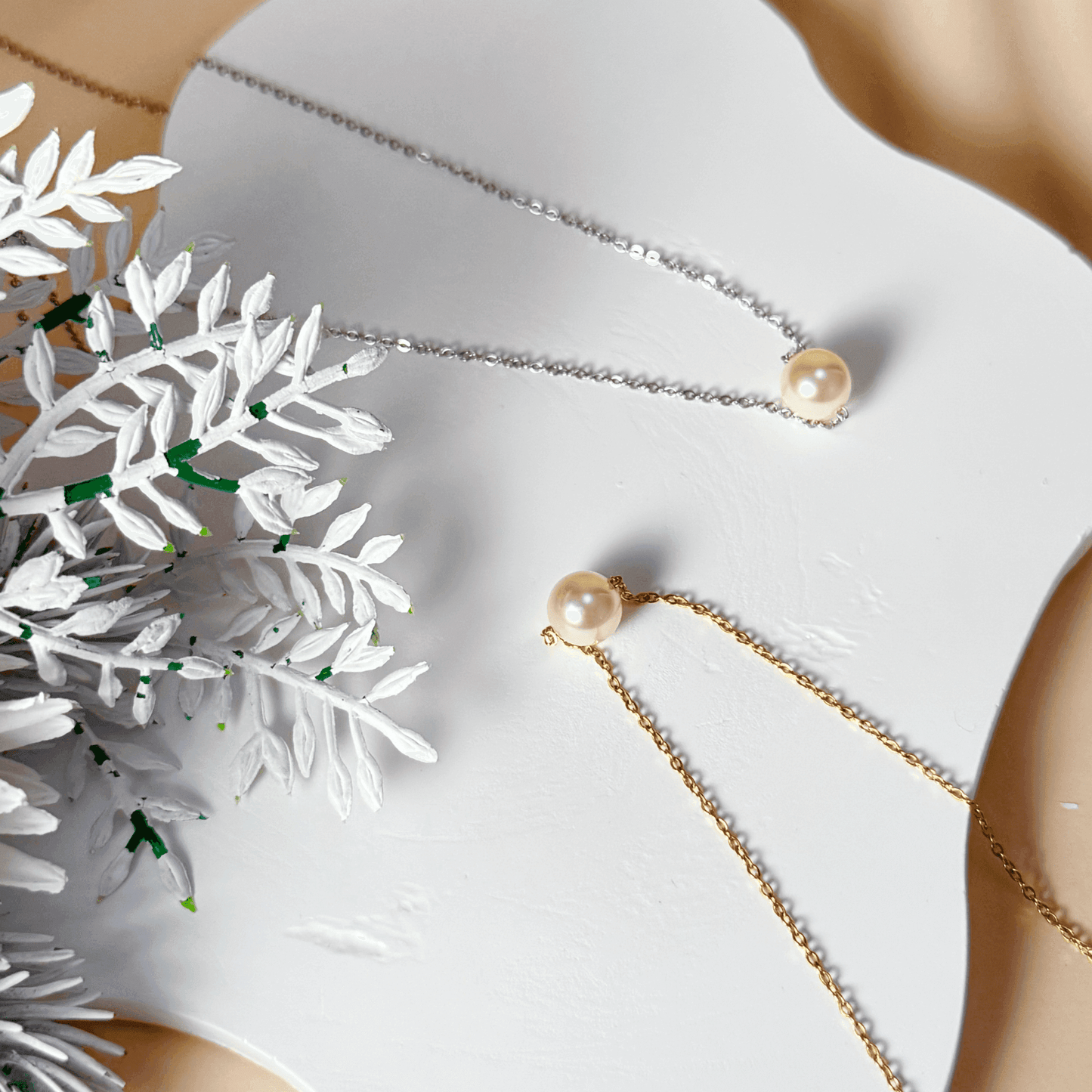 Minimalist Swarovski crystal pearl necklace with single pearl on gold and silver stainless steel chains, elegant everyday jewellery