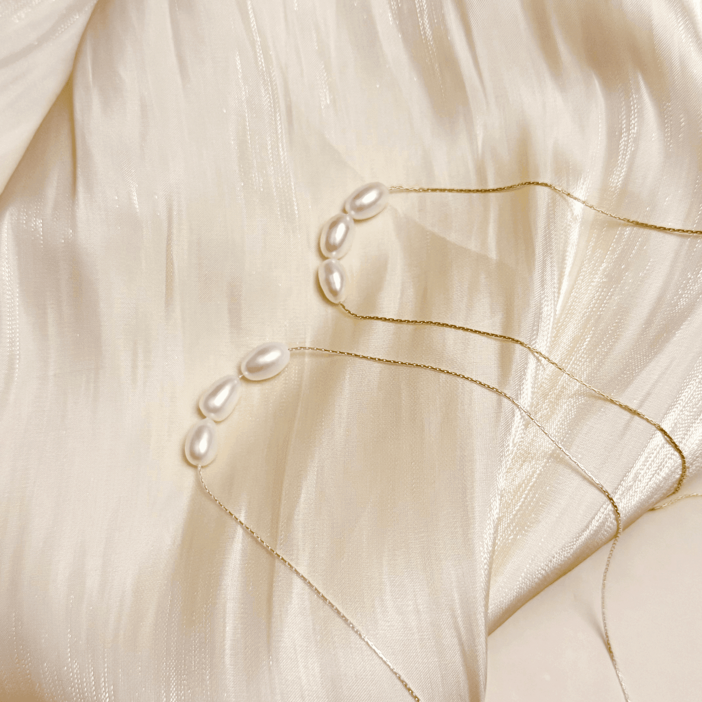 Gold and silver minimalist necklace with trio of 8–9 mm freshwater rice pearls, dainty and elegant for everyday wear or gifting.
