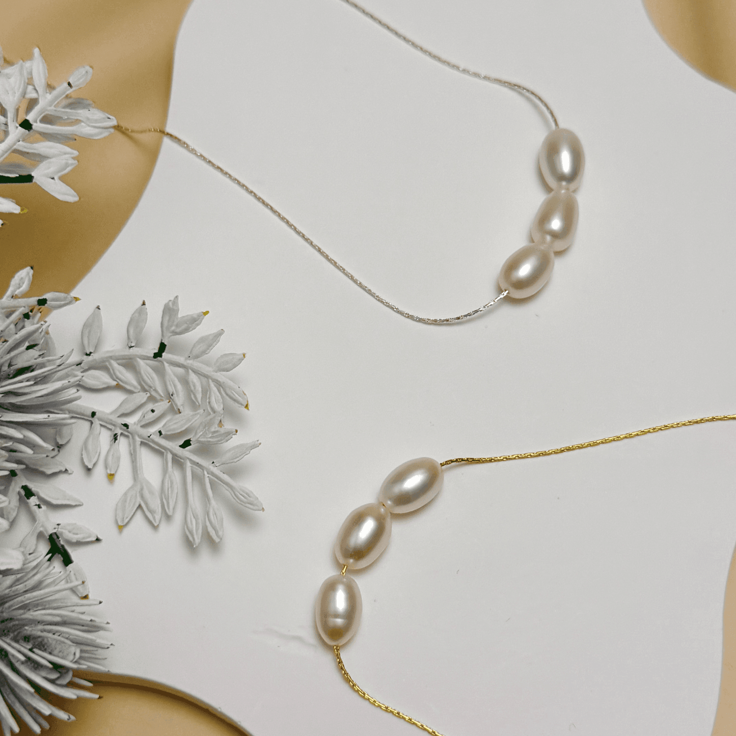 Gold and silver minimalist necklace with trio of 8–9 mm freshwater rice pearls, dainty and elegant for everyday wear or gifting.