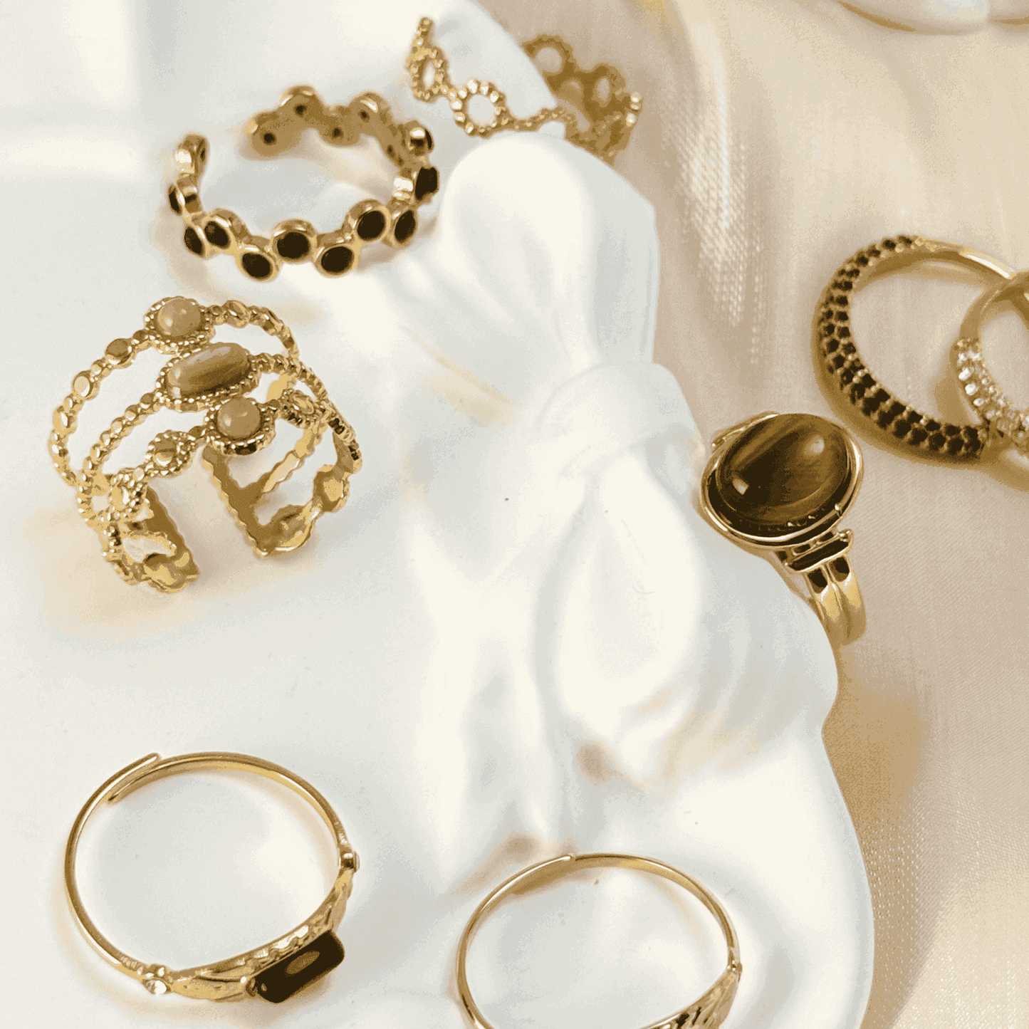 Gold stacking adjustable rings featuring natural stones and intricate boho designs. Waterproof and stylish, perfect for layering and everyday wear.