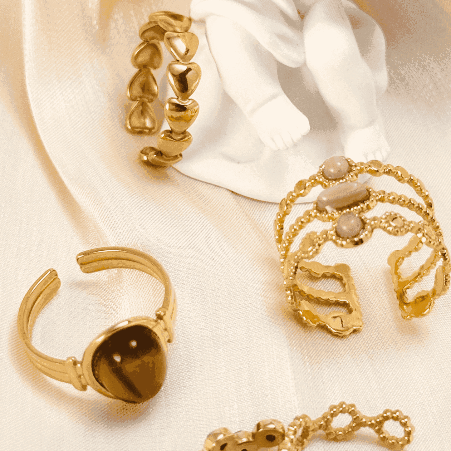Gold stacking adjustable rings featuring natural stones and intricate boho designs. Waterproof and stylish, perfect for layering and everyday wear.