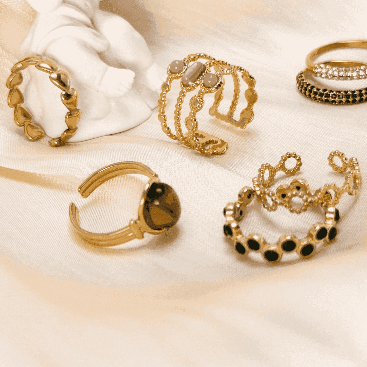 Gold stacking adjustable rings featuring natural stones and intricate boho designs. Waterproof and stylish, perfect for layering and everyday wear.