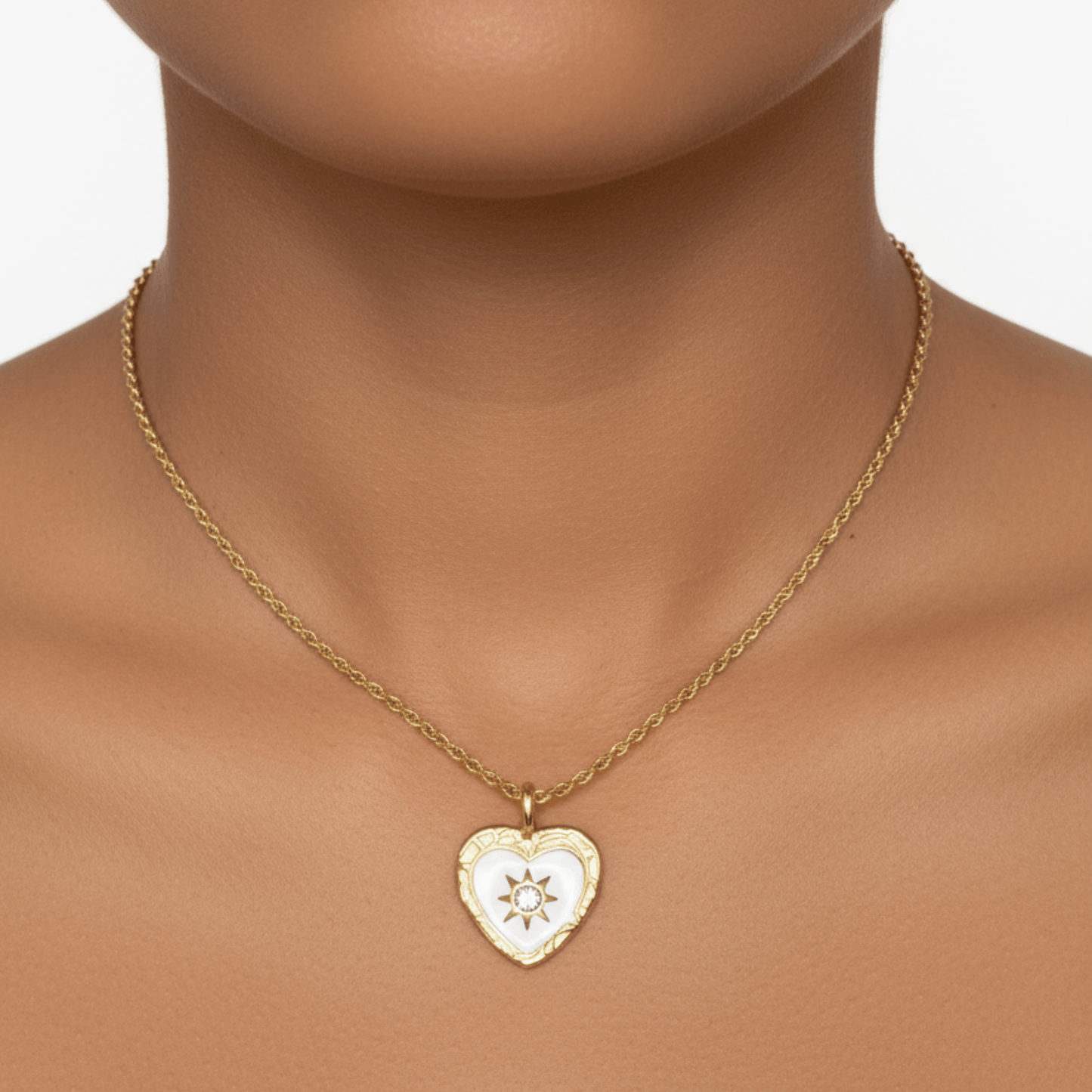 Gold sunburst heart zircon necklace with white enamel, waterproof and tarnish-resistant, perfect for everyday wear.