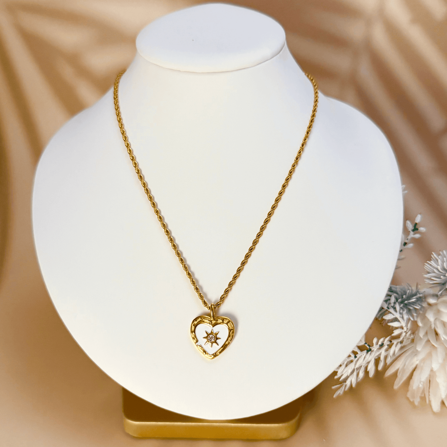 Gold sunburst heart zircon necklace with white enamel, waterproof and tarnish-resistant, perfect for everyday wear.