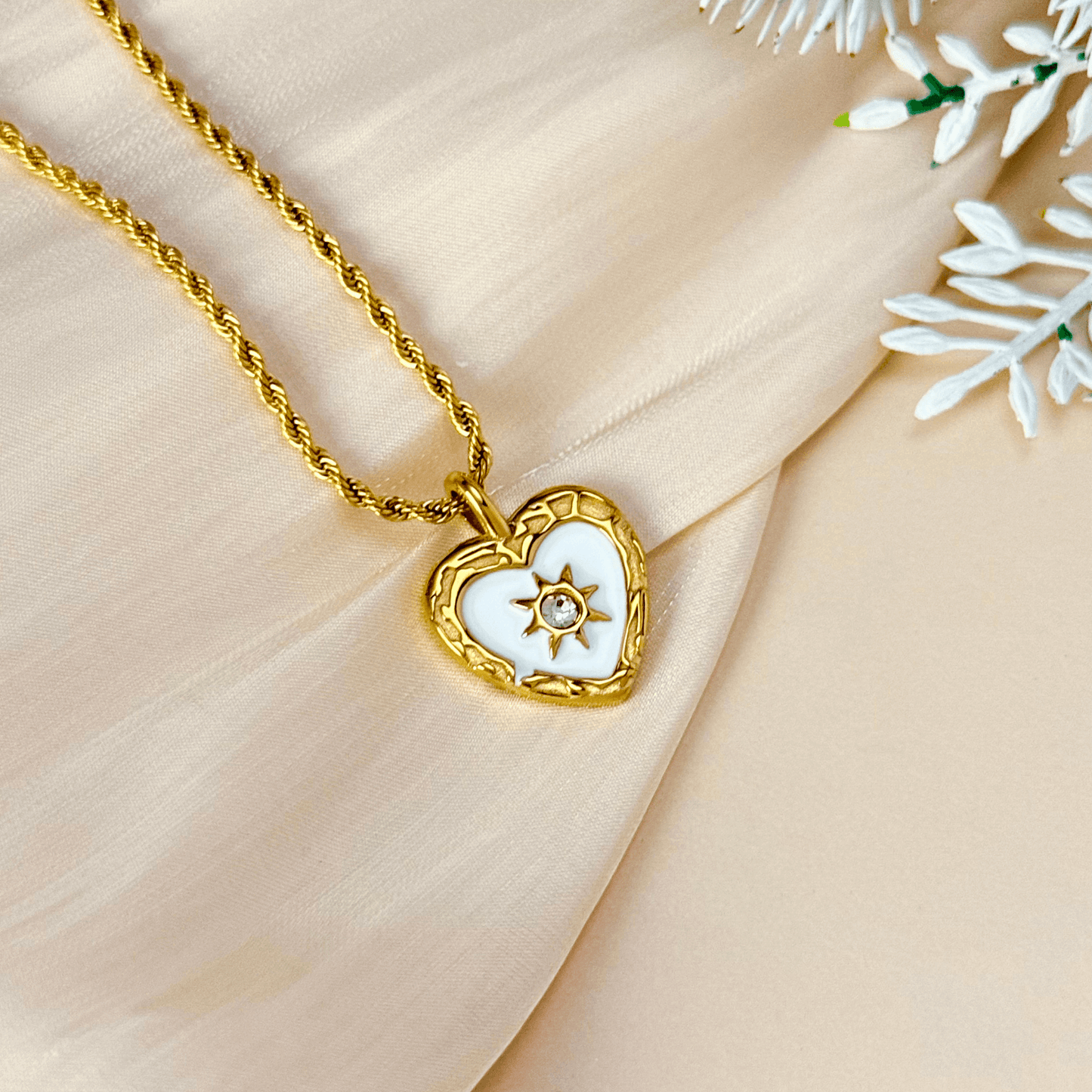 Gold sunburst heart zircon necklace with white enamel, waterproof and tarnish-resistant, perfect for everyday wear.