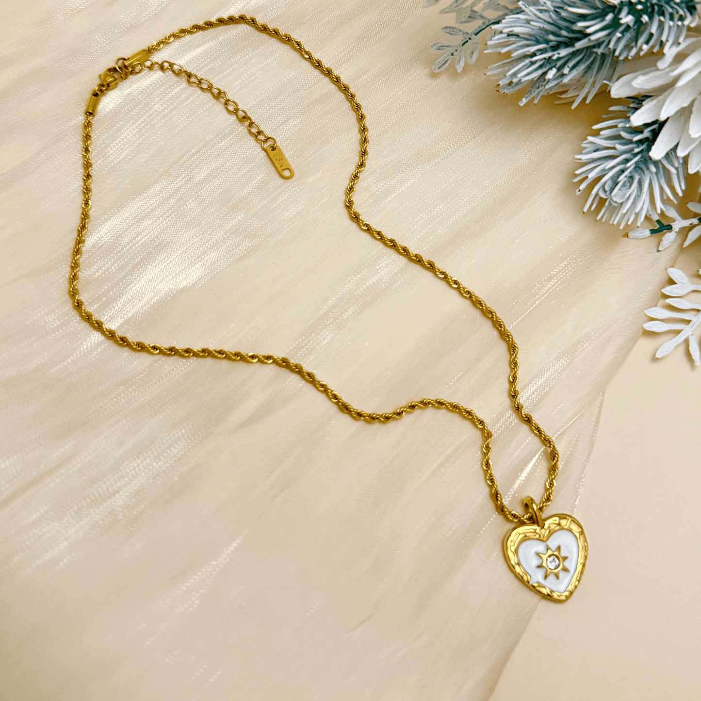 Gold sunburst heart zircon necklace with white enamel, waterproof and tarnish-resistant, perfect for everyday wear.
