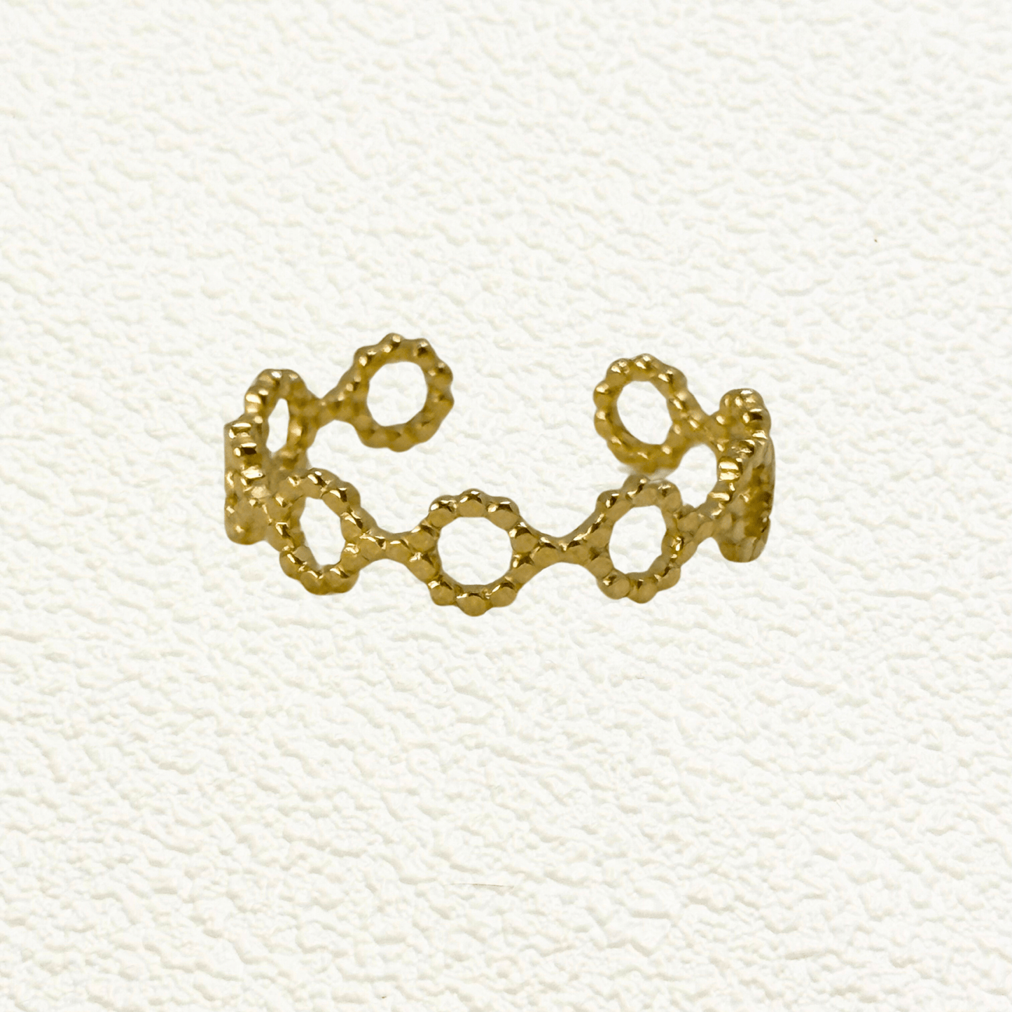 gold textured geometric open ring with hexagonal cutout design, adjustable and waterproof for everyday wear.