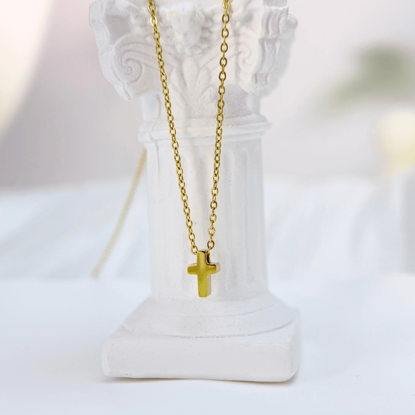 Gold tiny cross necklace symbolising faith and grace – MXW Jewellery