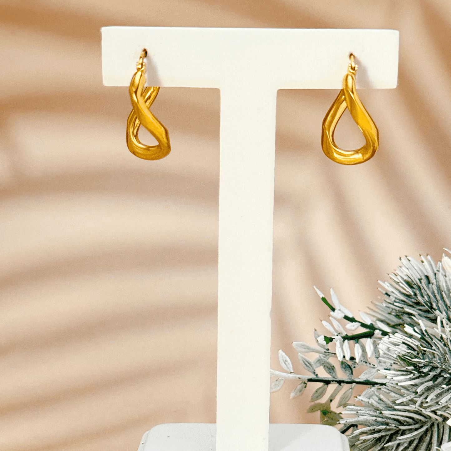 Gold Twisted Round Hoop Earrings with a modern twisted round shape, crafted in PVD gold-plated stainless steel, waterproof