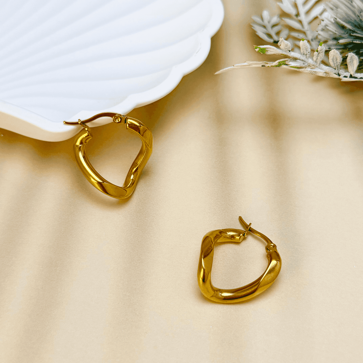 Gold Twisted Round Hoop Earrings with a modern twisted round shape, crafted in PVD gold-plated stainless steel, waterproof