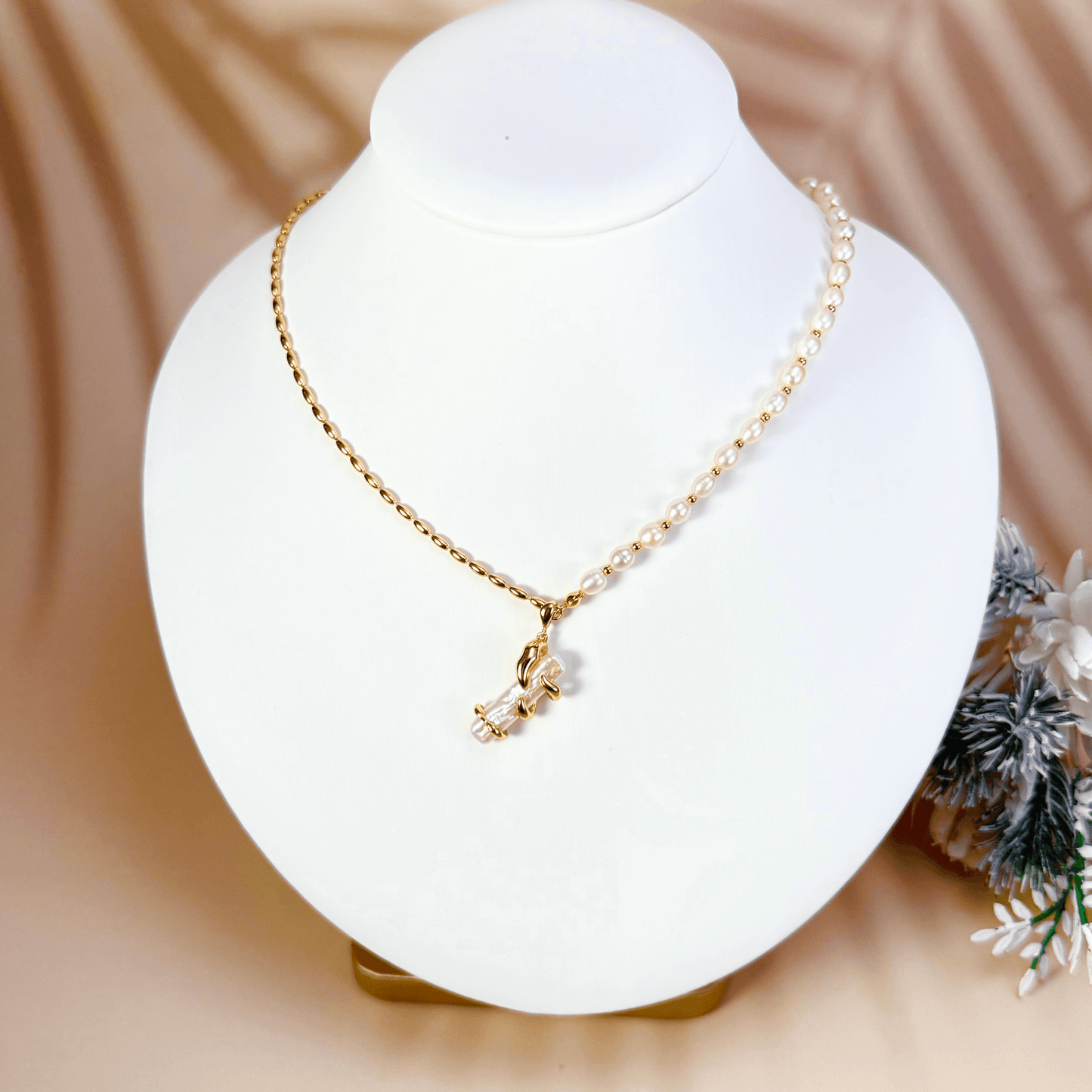 necklace with gold vine-wrapped pearl pendant on half pearl, half gold beaded chain
