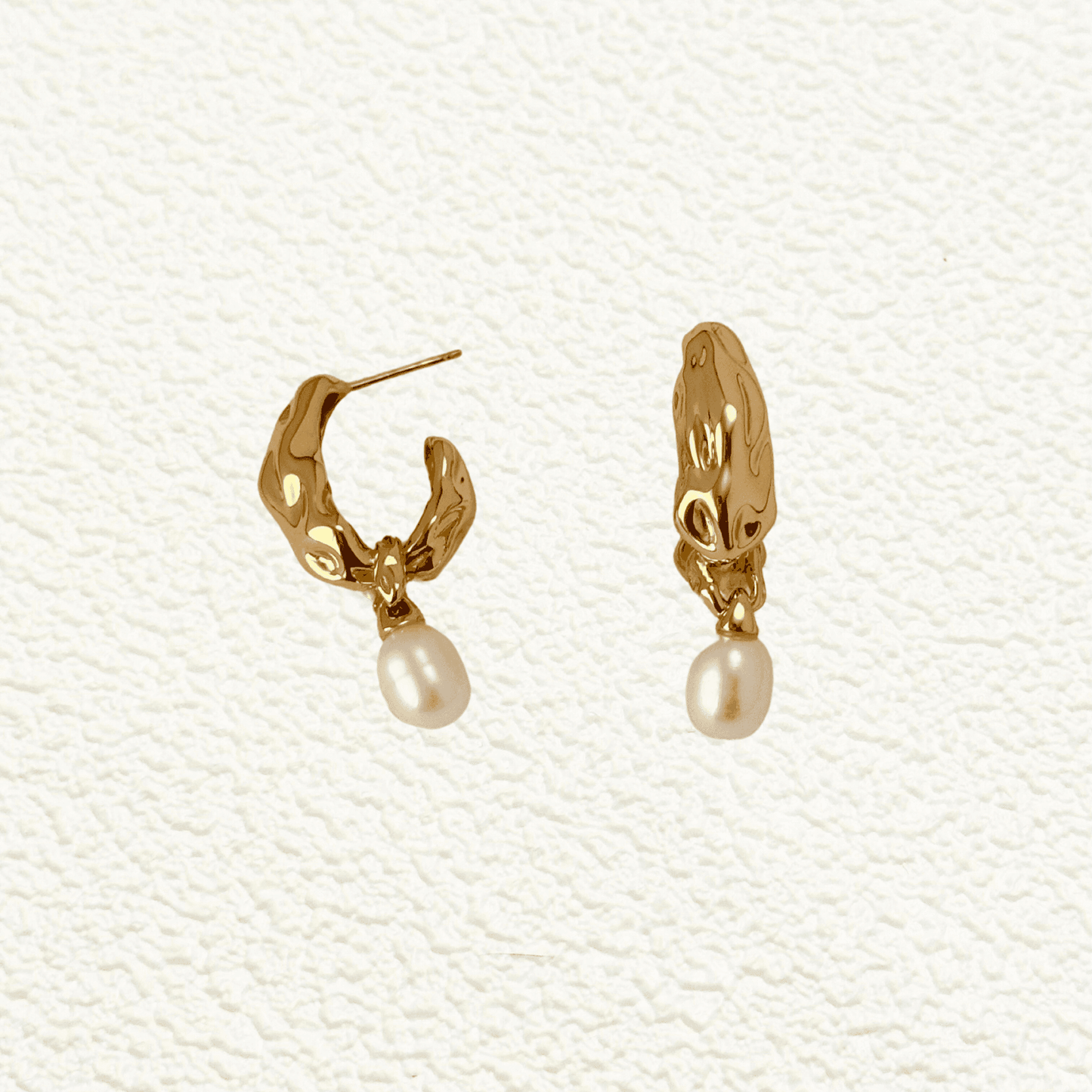 Elegant gold-plated freshwater pearl drop earrings with vintage molten texture, crafted in 925 sterling silver for a timeless, sophisticated look.