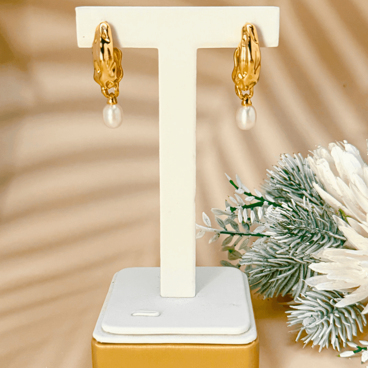 Elegant gold-plated freshwater pearl drop earrings with vintage molten texture, crafted in 925 sterling silver for a timeless, sophisticated look.